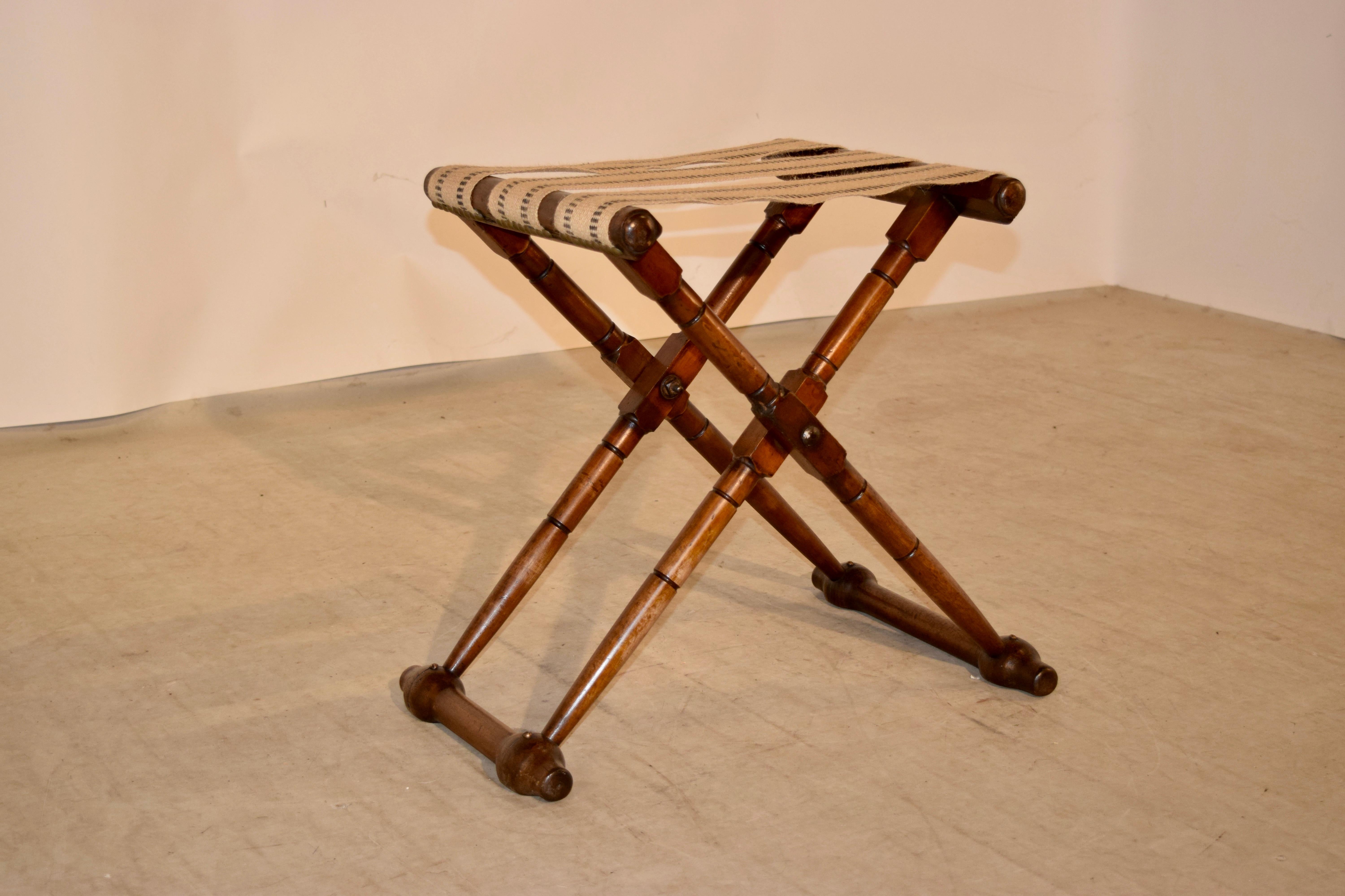 19th century folding luggage stand from England. The stand is made from mahogany and is hand-turned.