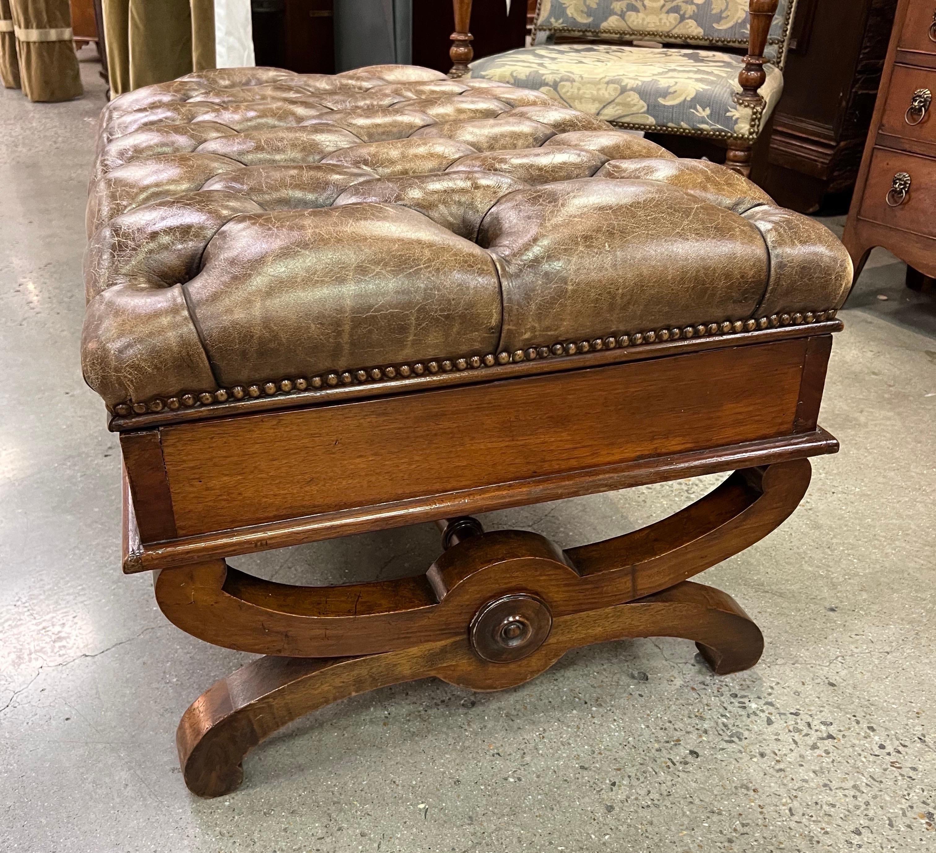 Sharp 19th century English tufted leather and mahogany ottoman with storage. Small coffee table size.