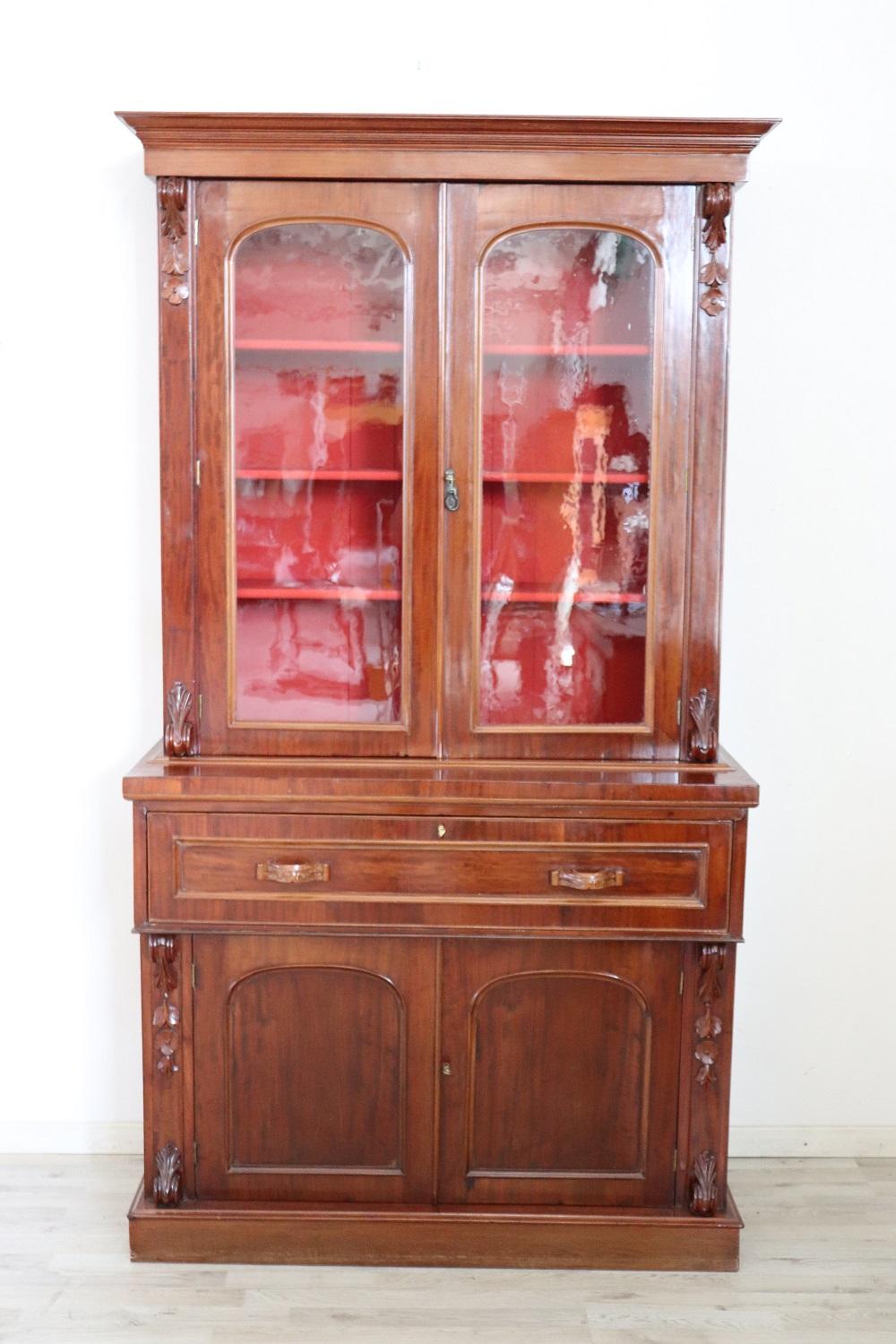 Elegant antique cabinet in precious mahogany 1880s. The openable floor allows a support to write. Inside eight small drawers. In front of both above and below some comfortable shelves. The upper part is with glasses to display your precious objects