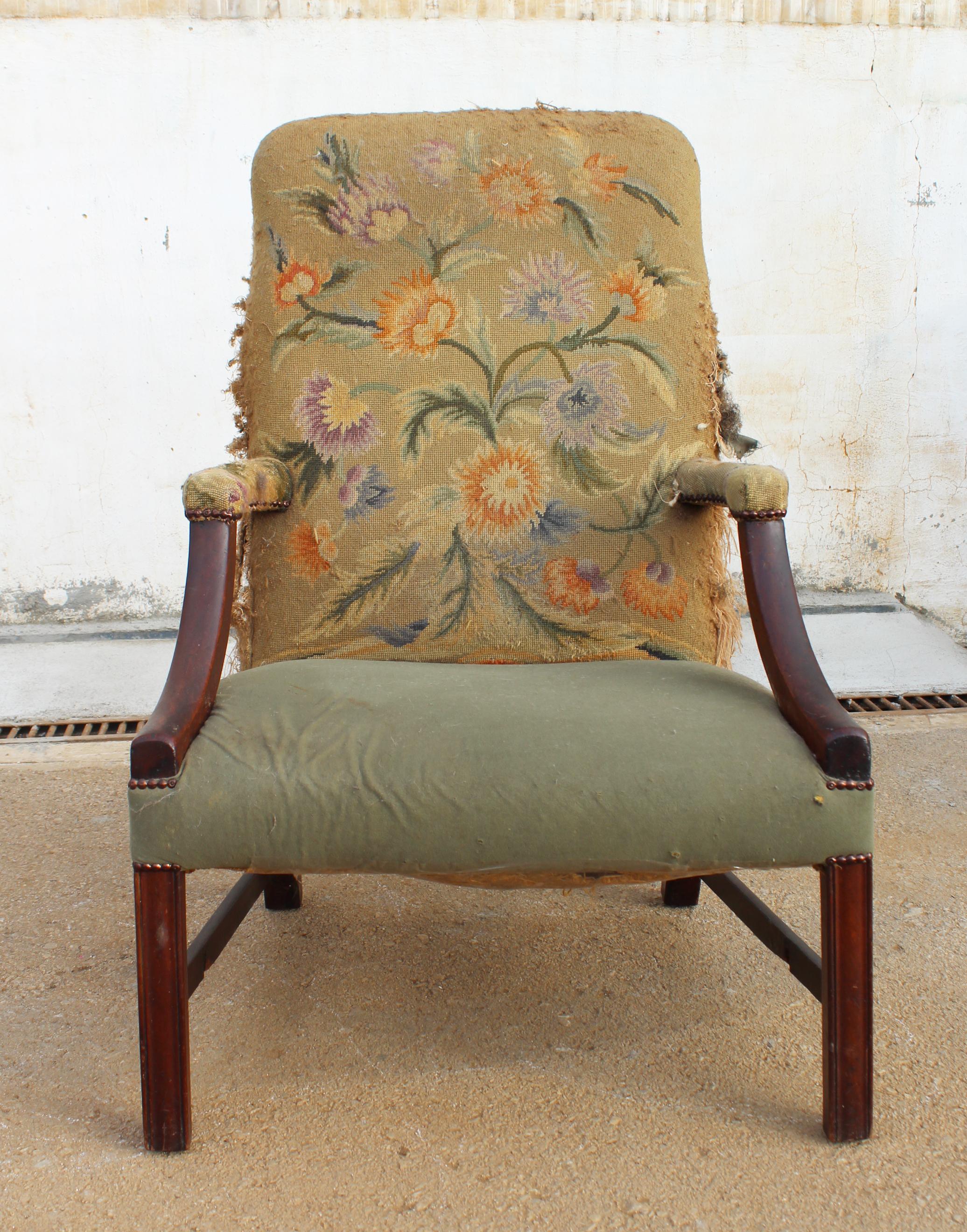 19th century English mahogany armchair with upholstery that needs repair.
  
