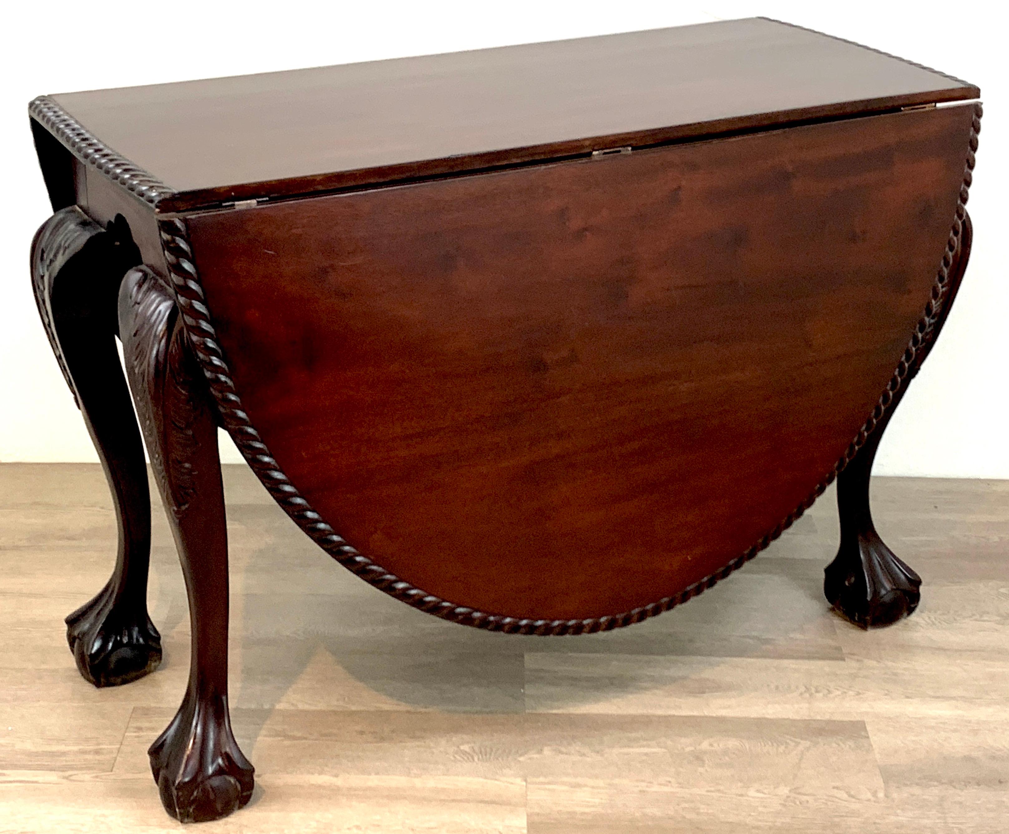 19th century English mahogany ball & claw foot tuck away dining room table, a versatile antique table, beautiful figured mahogany roped edge oval table, raised on four cabriole legs with well carved ball and claw feet. When completely open the table