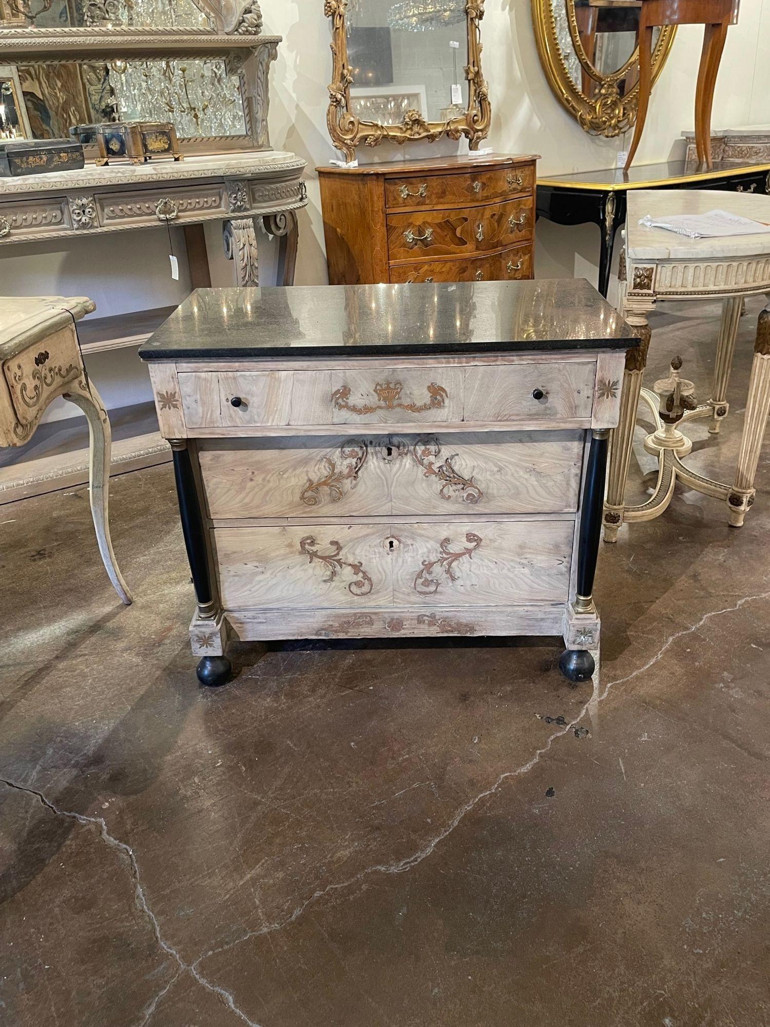 Gorgeous 19th century English mahogany bleached chest with decorative brass inlay. This piece also has a marble top and 3 drawers for storage. Makes an elegant statement!
