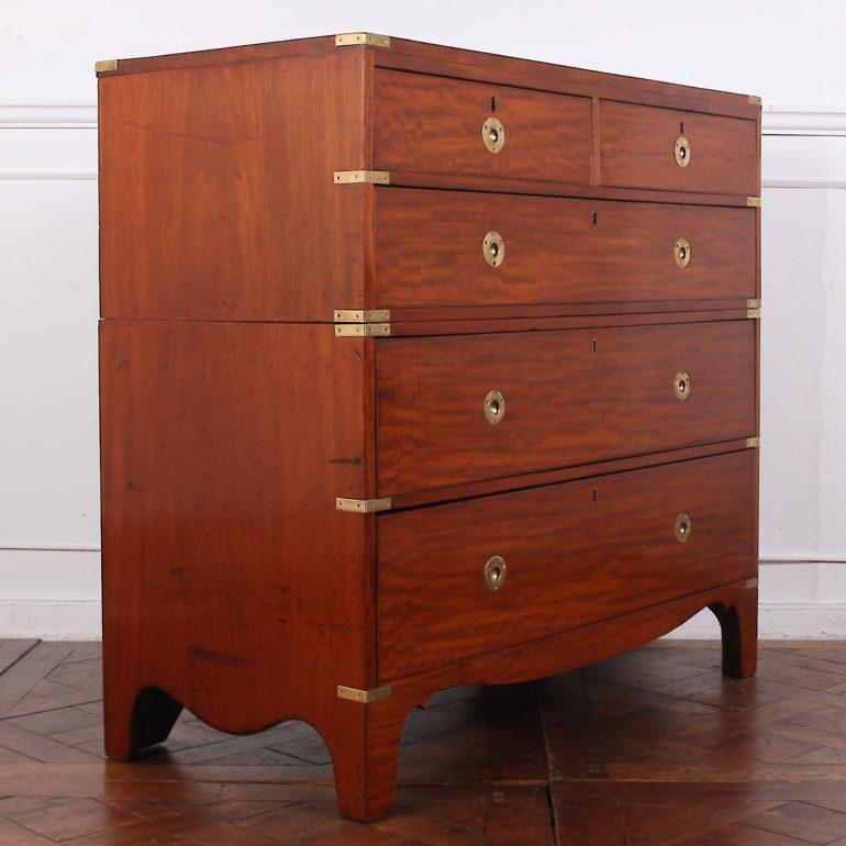 A 19th century mahogany brass-bound English Campaign chest in two parts with round brass recessed pulls and inset brass corners, the whole raised on bracket feet. Nice figuring to the mahogany grain and newly-restored with a traditional French