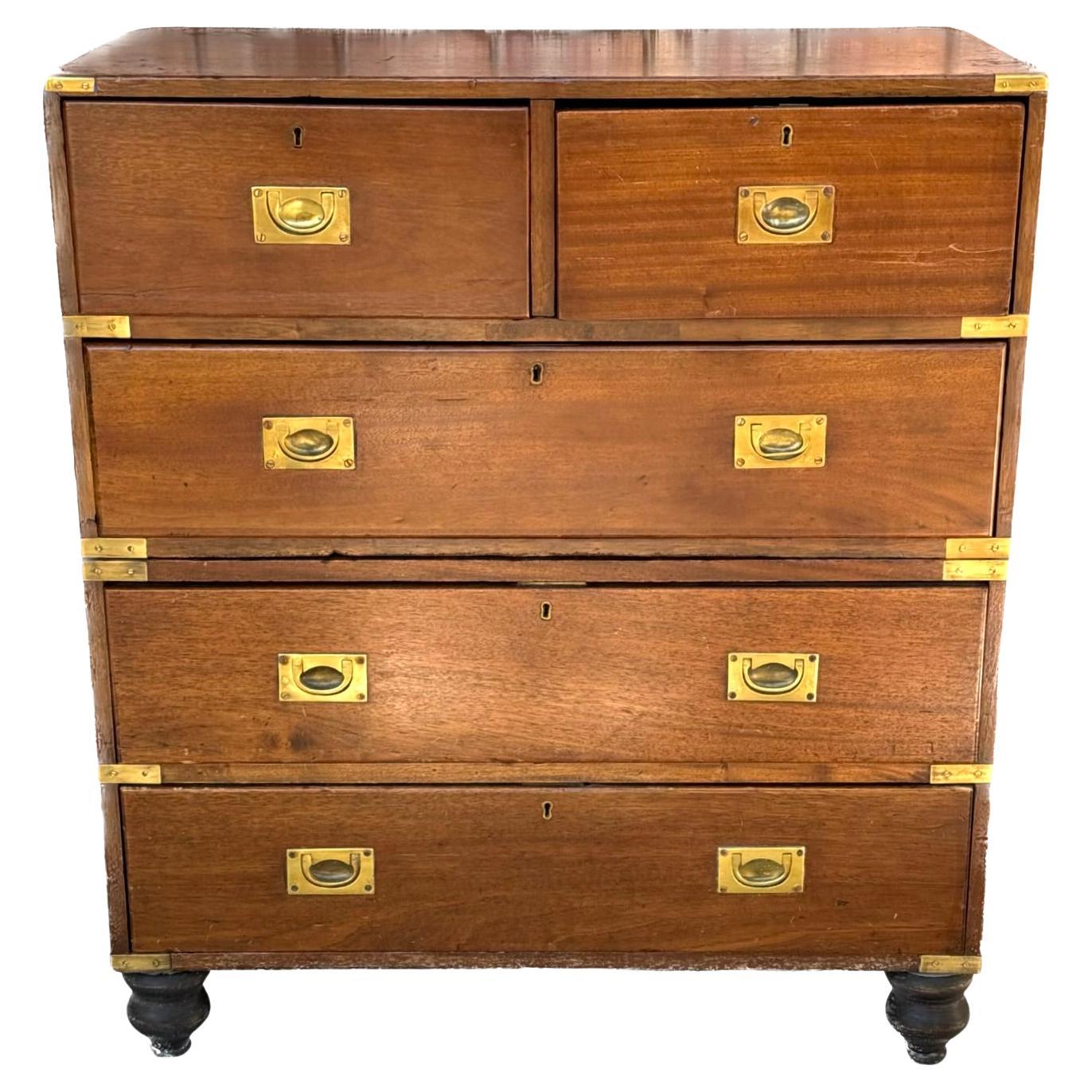 19th Century English Mahogany Campaign Chest. Chest has two short drawers on top with three longer drawers underneath. Chest is made of two parts. Original brass hardware. Beautiful patina. Has stamp on brass lock 