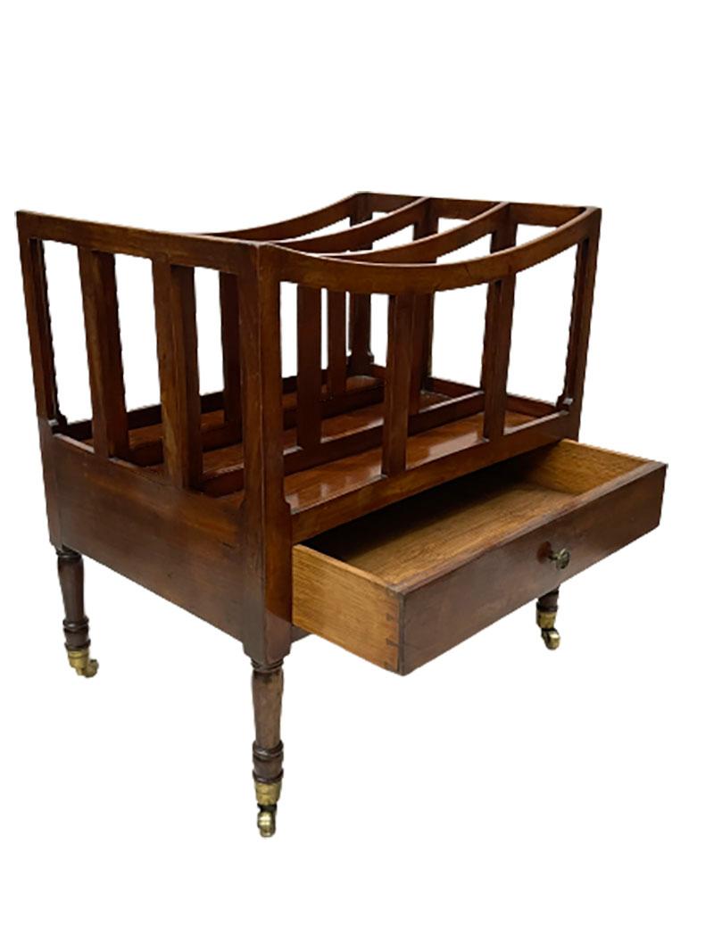 19th century English Mahogany Canterbury

A Canterbury in mahogany wood with three divisions and a drawer, raised on legs with brass castors.
Made in England in the 19th Century, between 1820-1840
The Canterbury measures 49 cm high, 45 cm wide