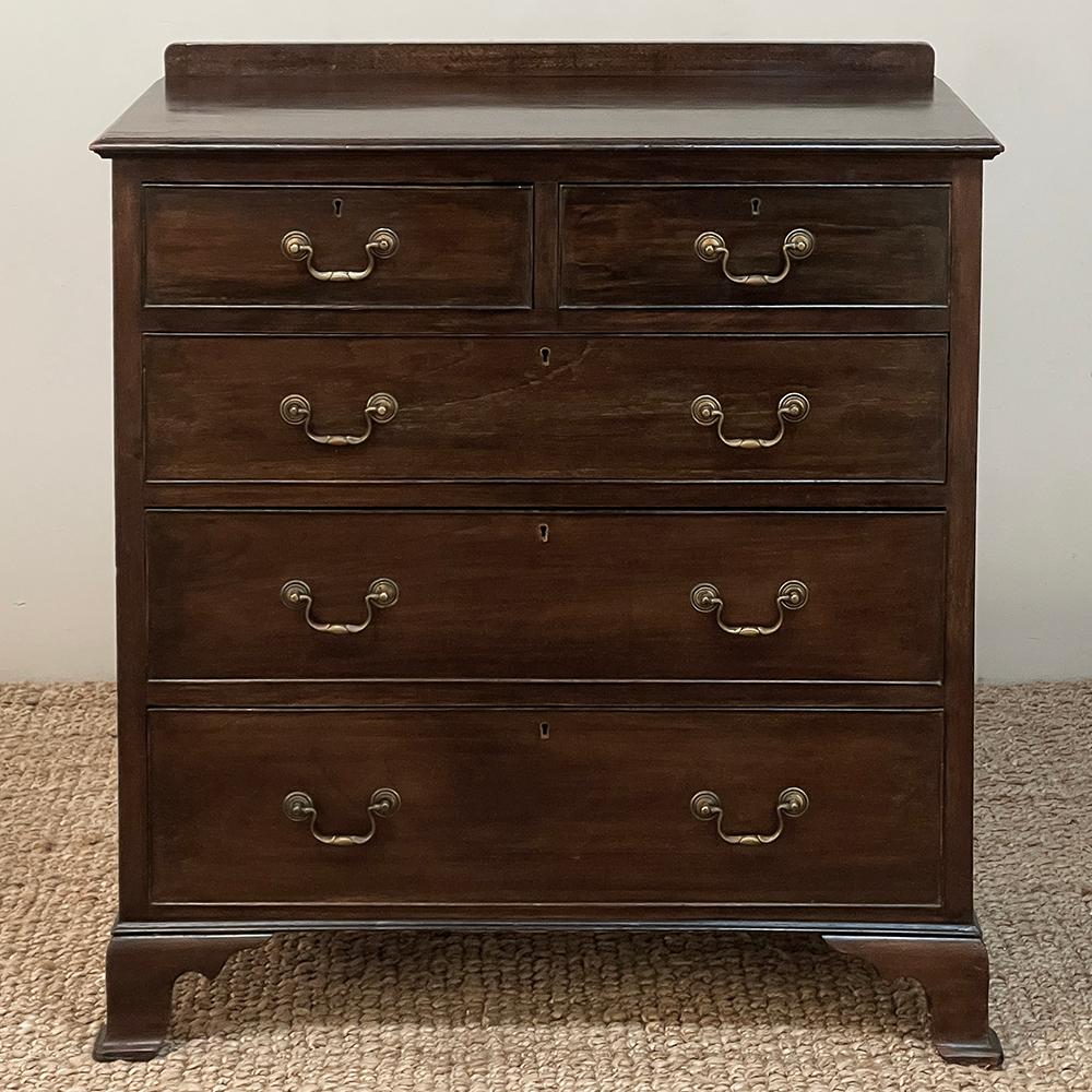 19th century English Mahogany Chest of Drawers has a decidedly Colonial look, with style cues inspired by the Queen Anne furnishings of prior centuries. Created from exotic mahogany imported from the Americas, it features a tailored architecture