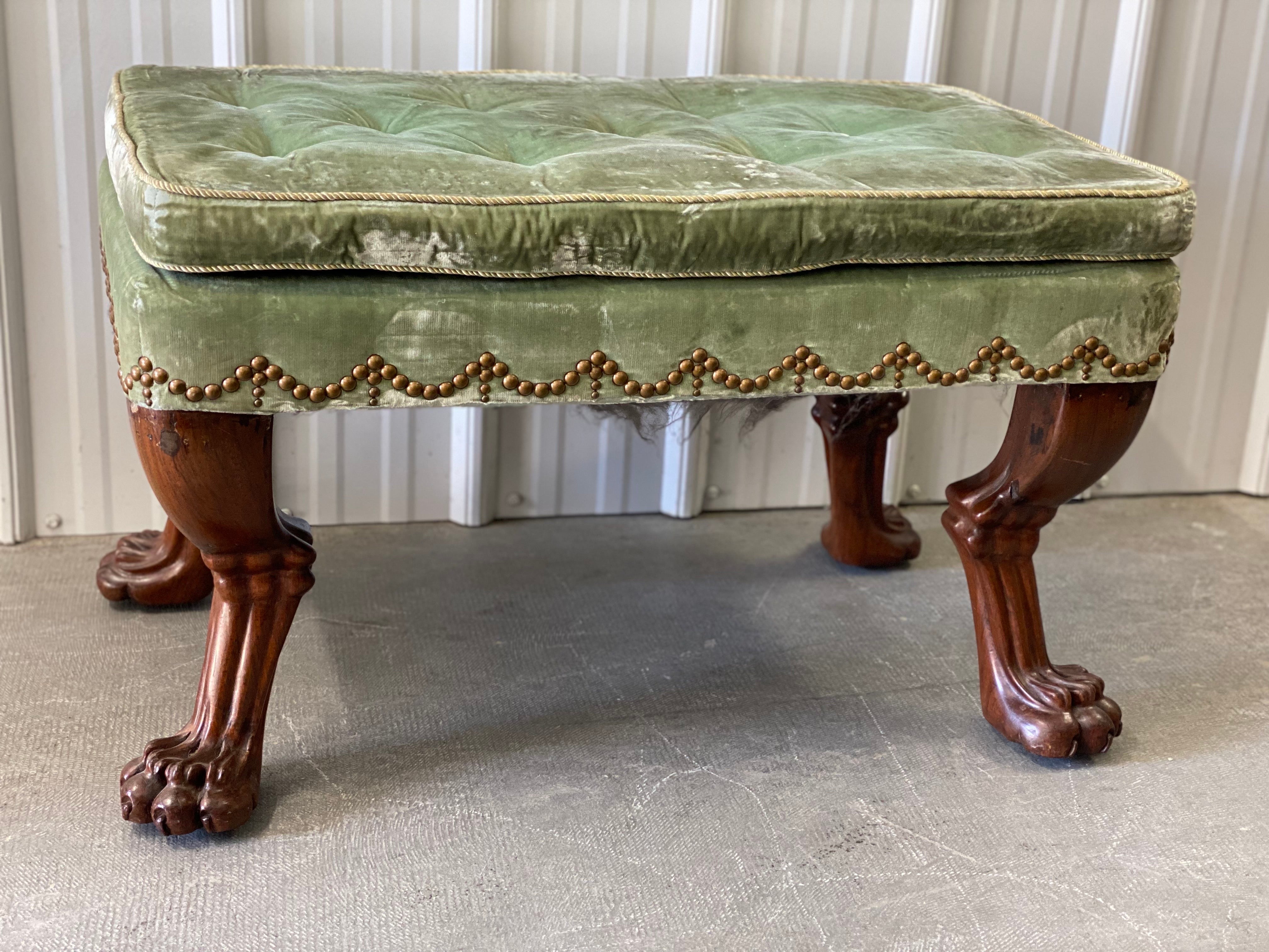 18th Century English Mahogany Clawfoot Stool in Velvet with Nailheads, Sourced by Albert Hadley.
Four excellently hand-carved mahogany legs ending in clawfoot paws with a tufted loose cushion upholstered in a celadon green velvet fabric with a