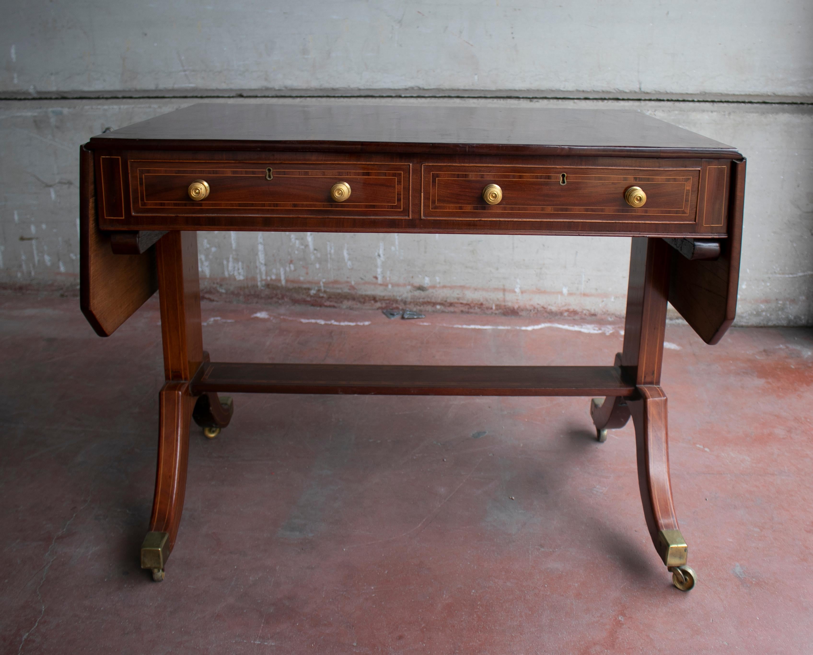 19th century English mahogany folding table.

Full width open: 150cm.