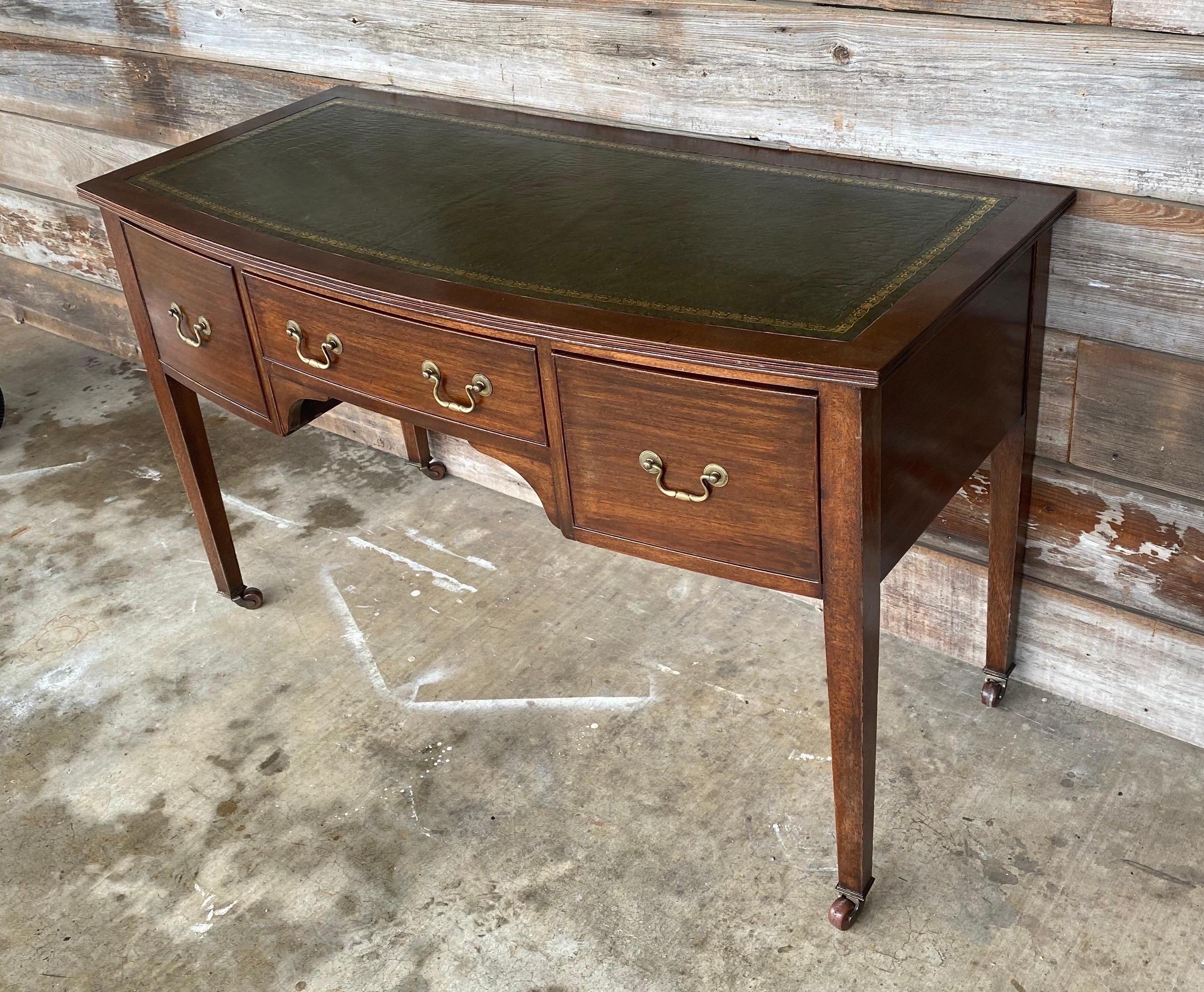 19th century English mahogany leather top desk or console on castors.