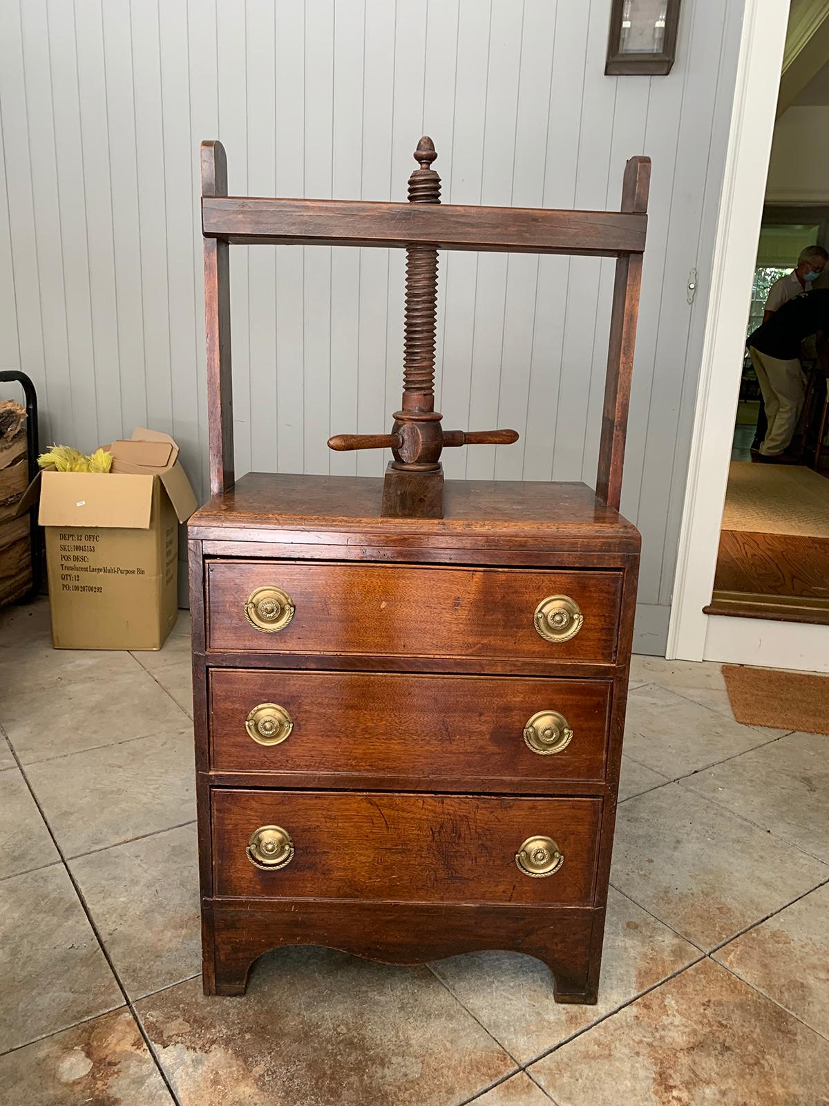 19th century English mahogany linen press with three drawers.