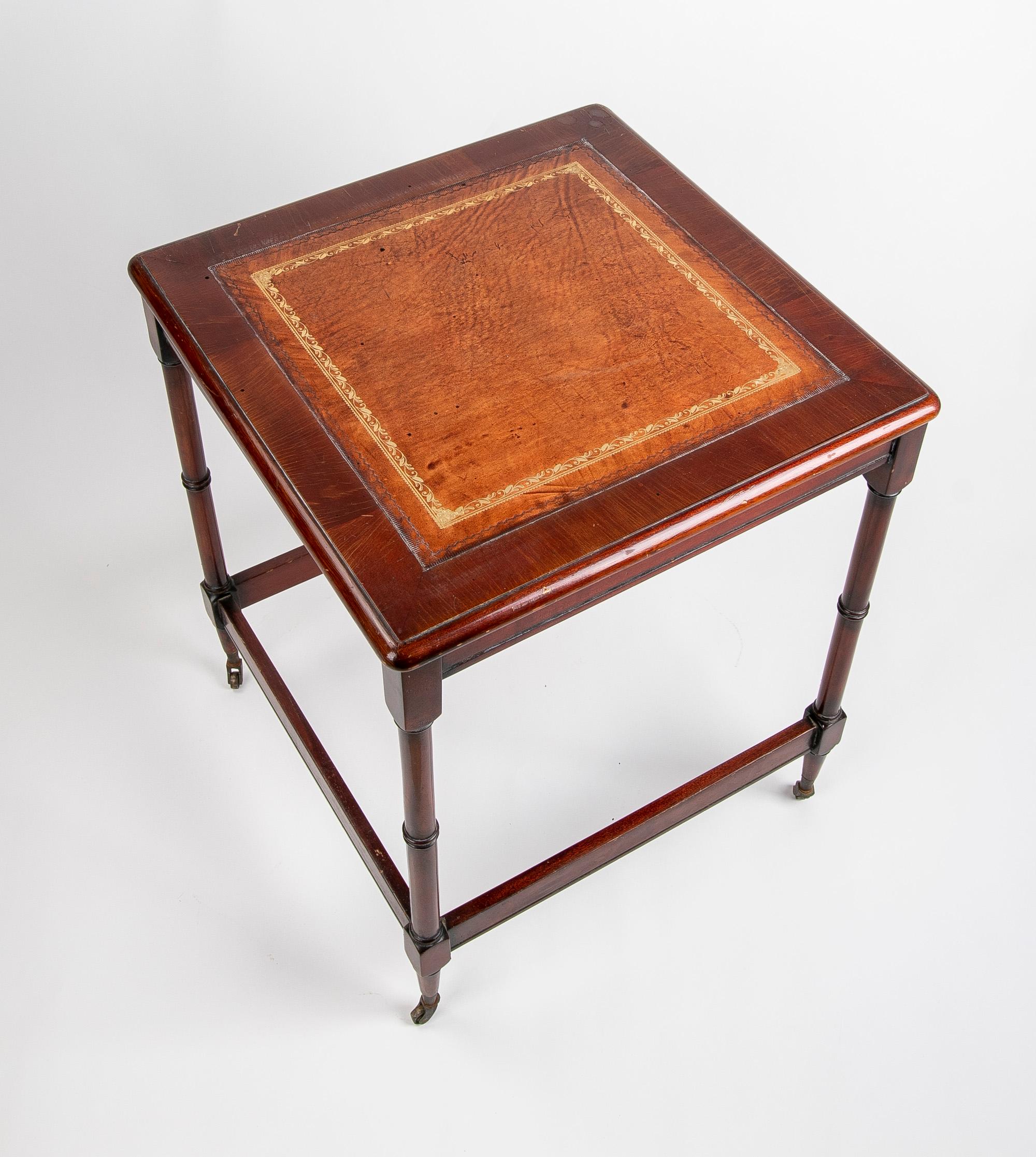 19th Century English mahogany side table with castors with a 19th century mahogany top.