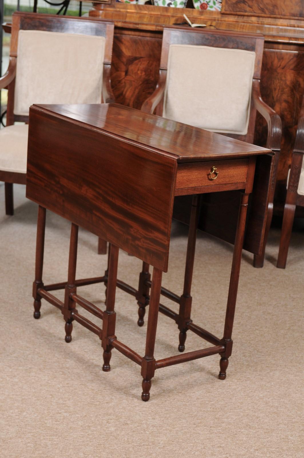 Mahogany drop leaf table with spider legs, England, 19th Century.