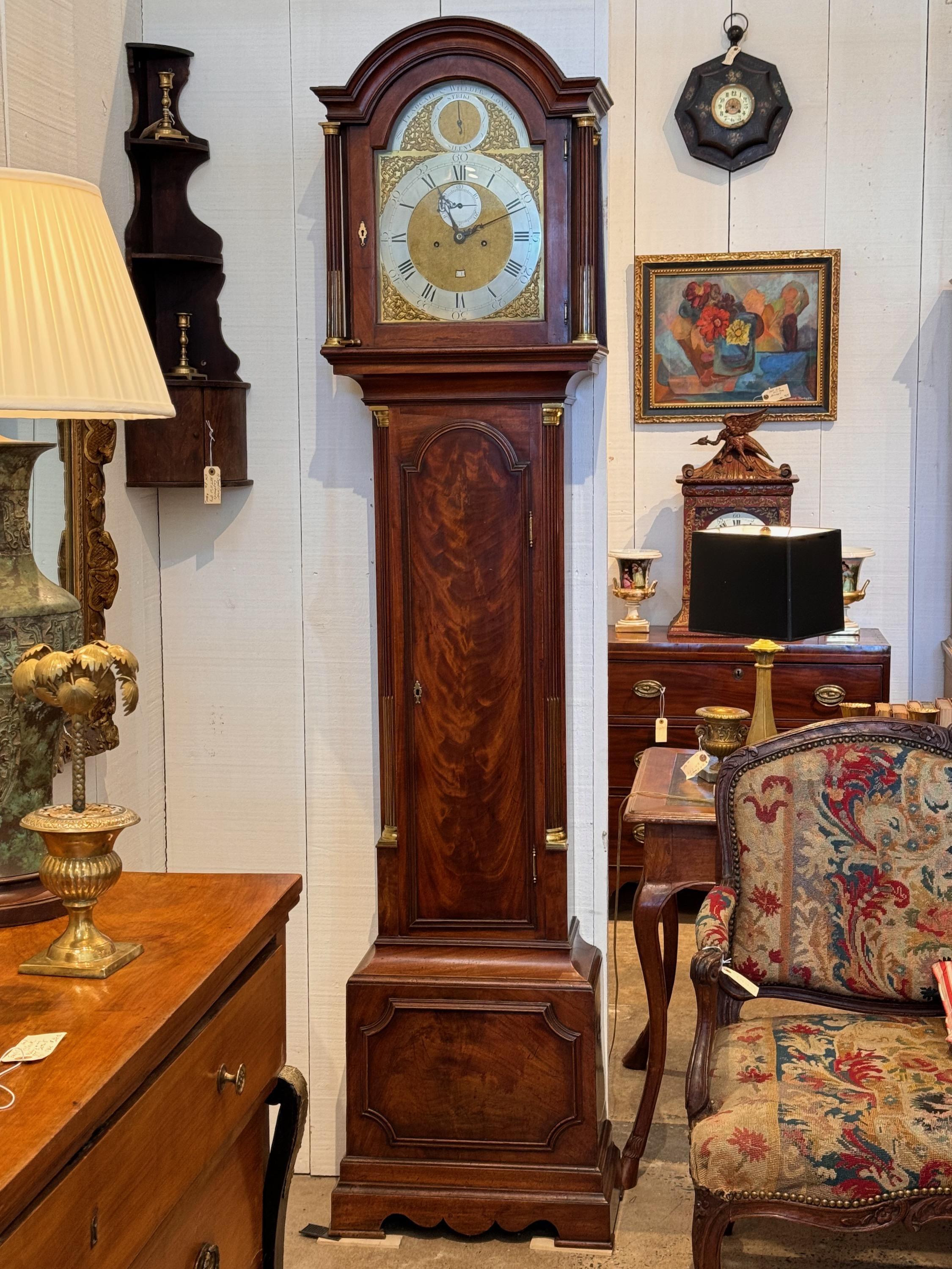 A very beautiful mahogany tall case clock. It has brass accents. And is working now. Made in the 19th Century.