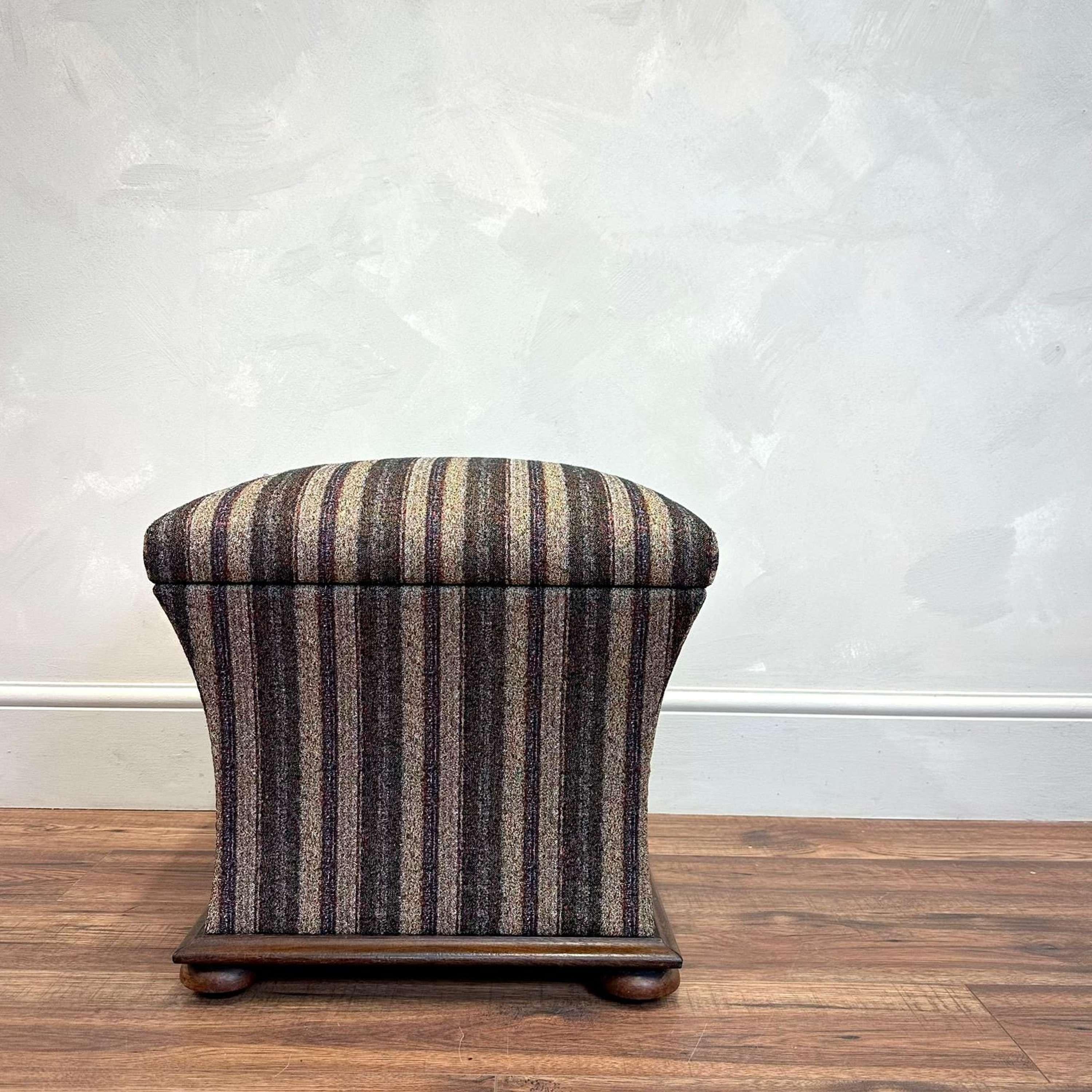 English 19th Century upholstered footstool

Mahogany base with turned bun feet 
Lovely quality striped fabric with calico lining 

Height - 42 cm 
Width - 48 cm
Depth - 42.5 cm
Please message if any further info or photos are required 

We are happy