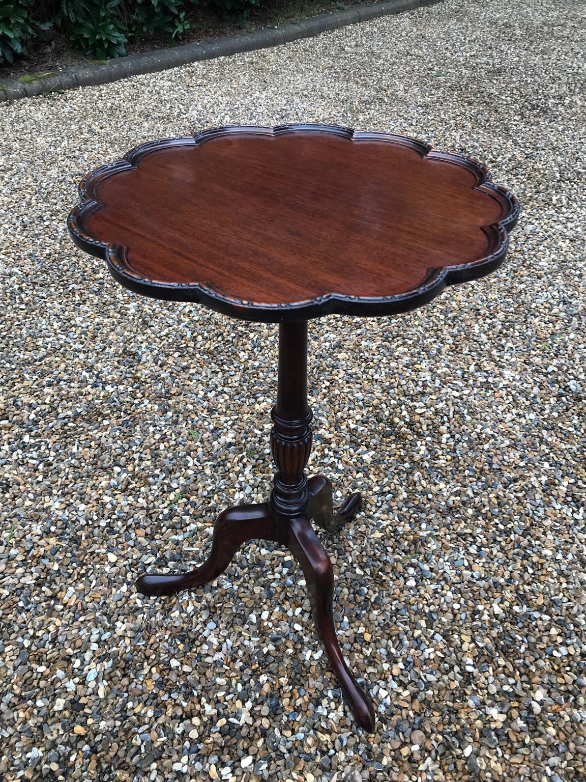 19th century mahogany wine table, with carved edging to top supported on a turned column with three splayed legs,

circa 1890

Dimensions:

Height: 25 inches - 71 cms
Diameter: 18 inches - 45 cms.