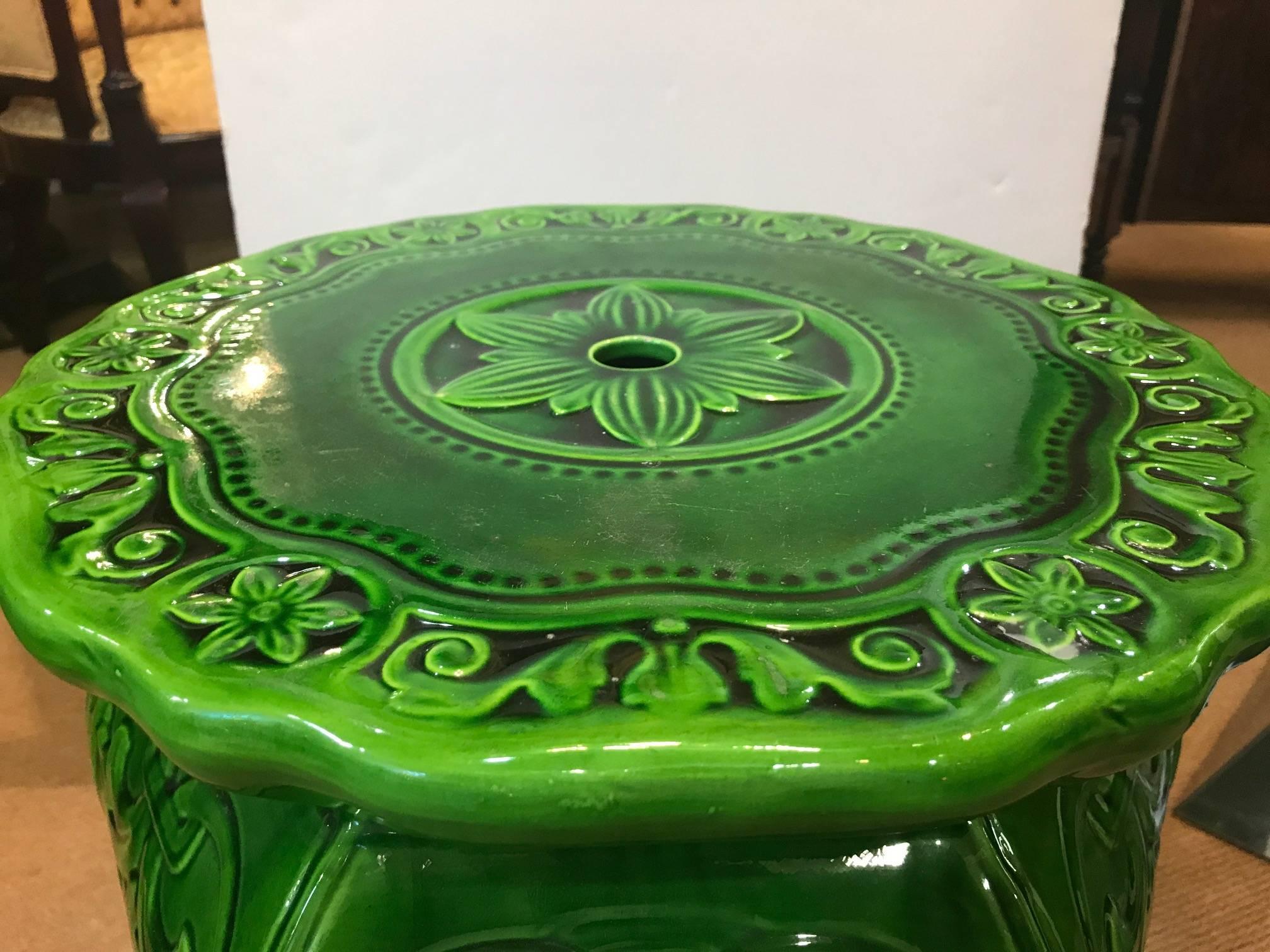 A vibrant green Majolica garden seat, made by Minton, year mark 1897. Designed by Augustus Welby Pugin, hexagonal baluster form body. Marked on the underside Minton and England #18 and mark of the swan. Elegant urn shape.