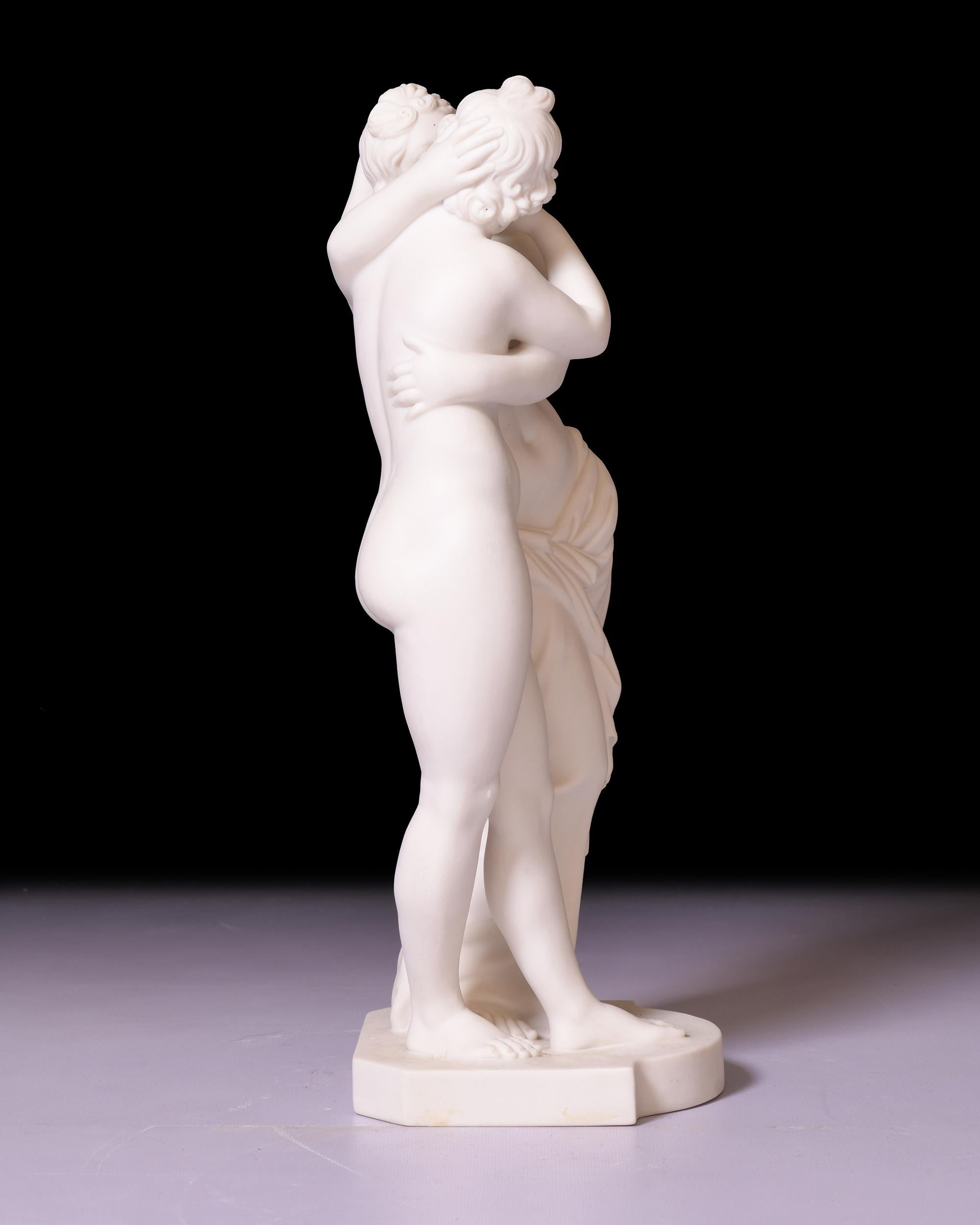 A stunning and most attractive minton parian figural group of Cupid and Psyche by Hamlet Bourne, the classical lovers in passionate embrace on a bow fronted plinth. The Roman original of this beautiful group (itself a copy of an earlier Hellensitic