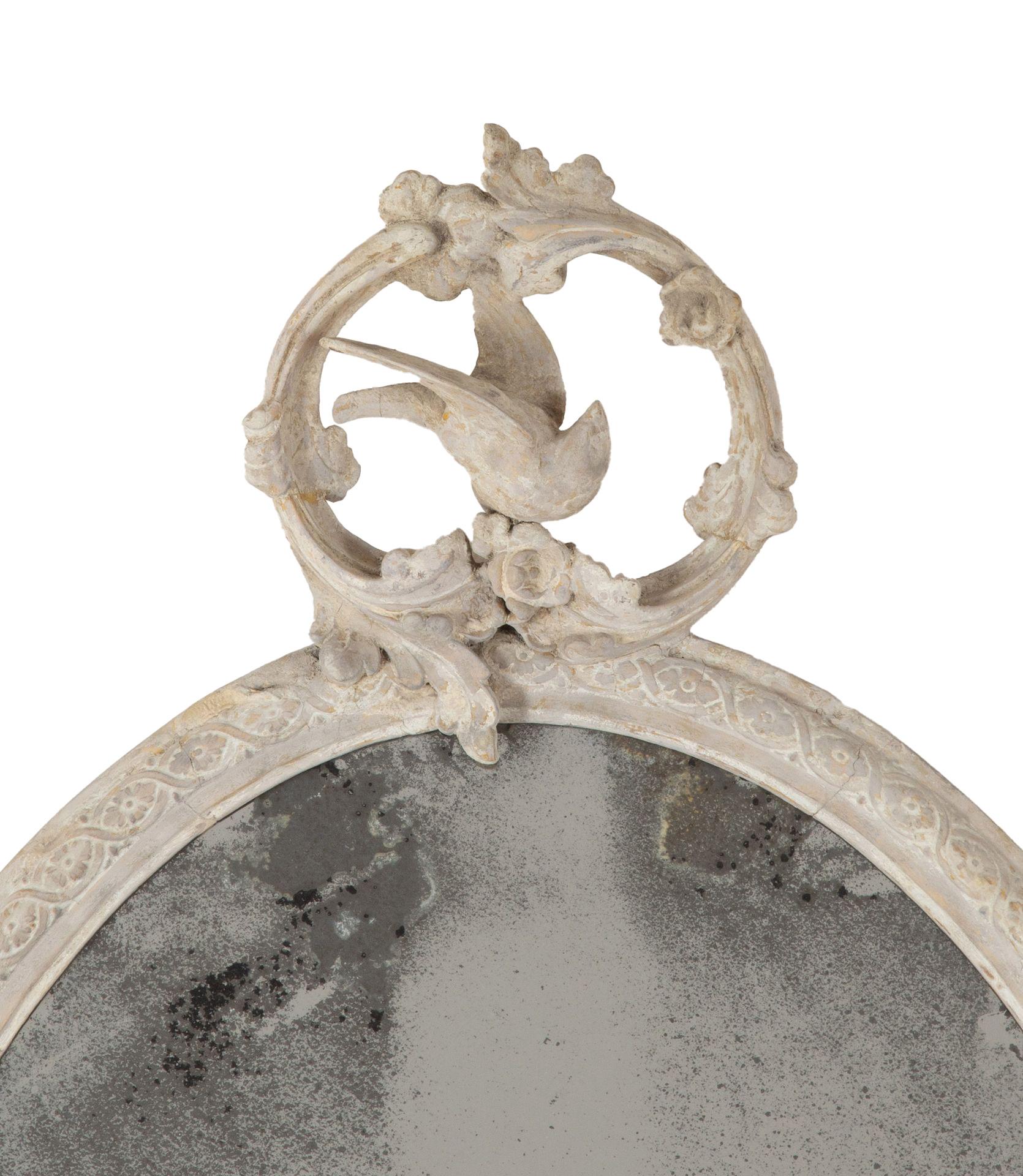 English mid 19th century mirror with charming song bird scrolled crest and acanthus apron. 

Original highly foxed mercury plate with a grey wash