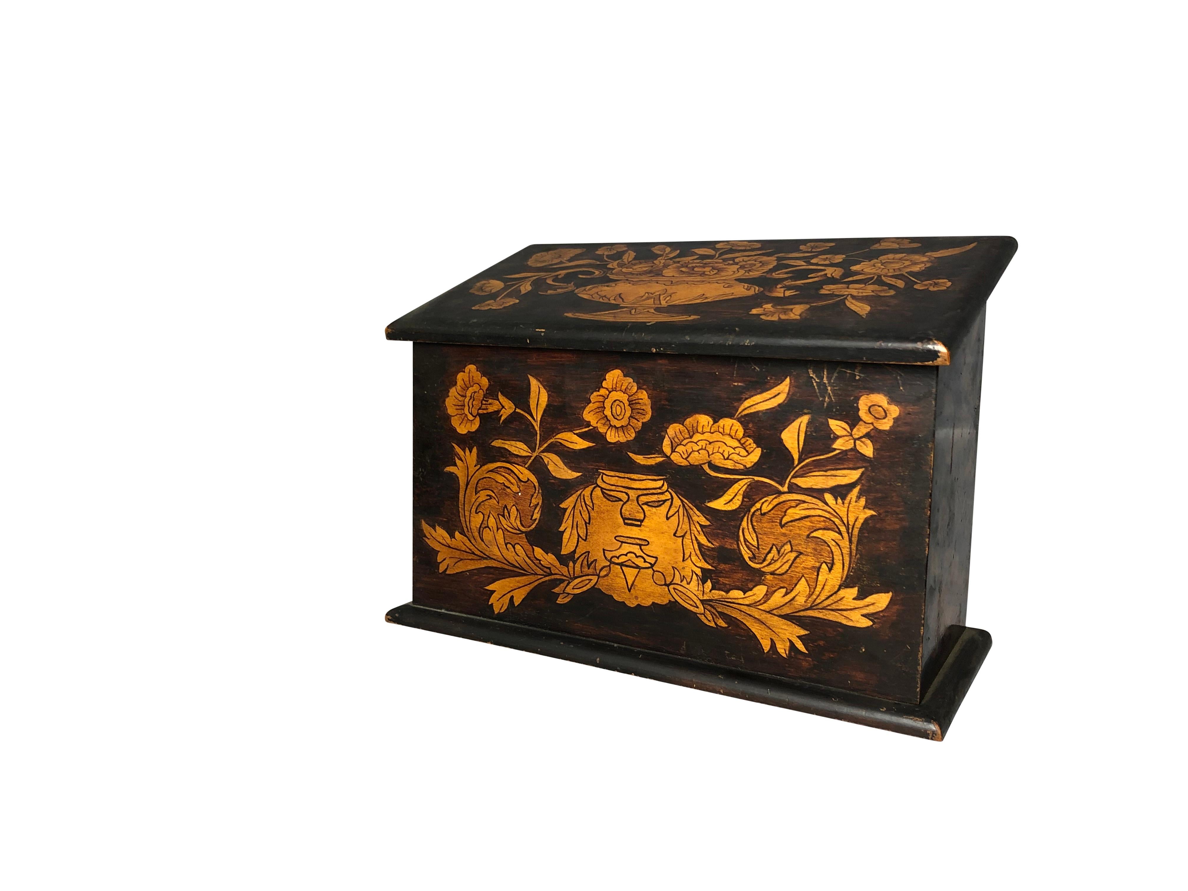 A beautifully hand carved 19th century English oak inlaid letter box. Excellent addition for any home, with stunning floral detail and design. The box depicts scenes of birds, butterflies and floral inlay. A truly wonderful piece, and ready for home