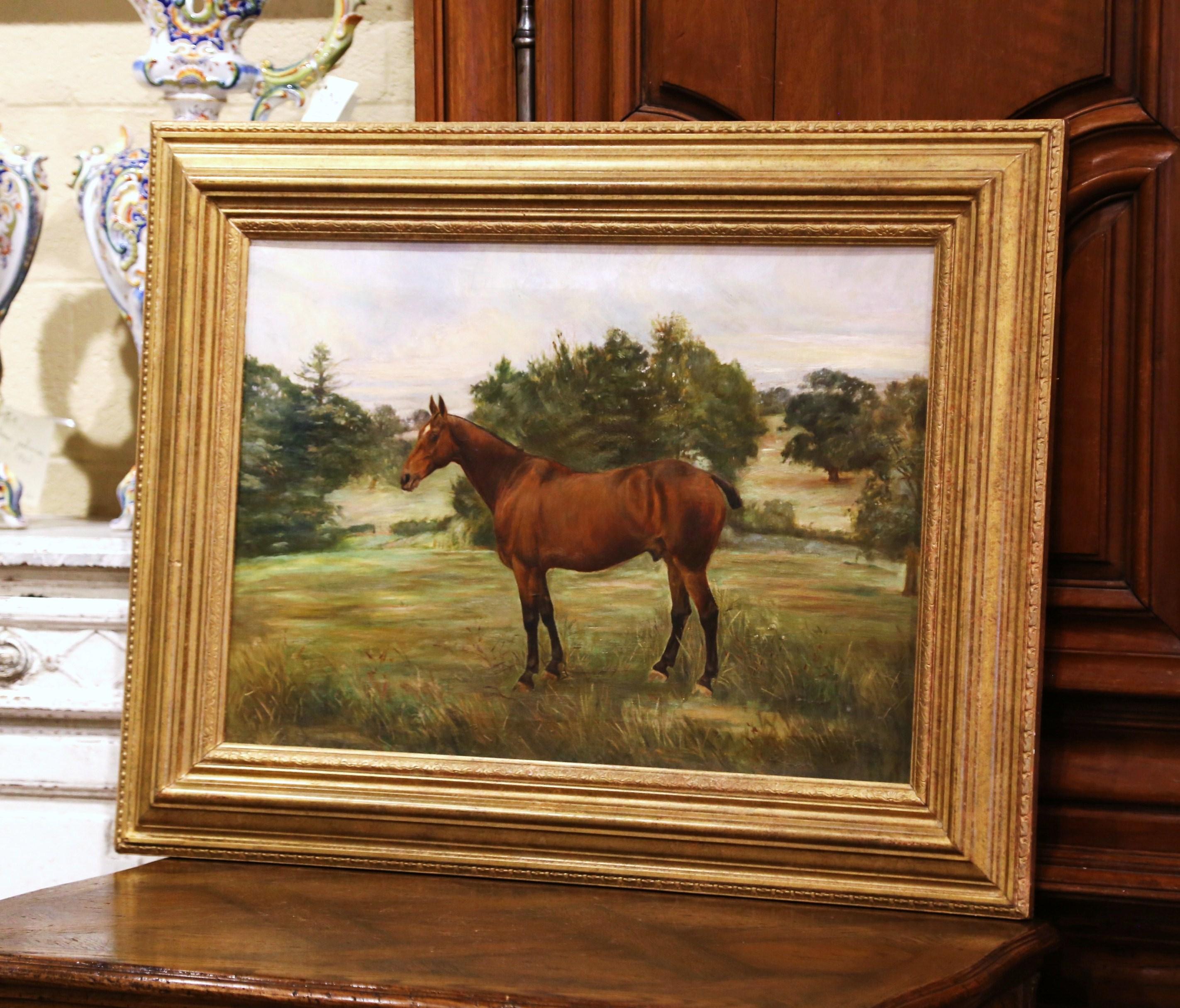 Decorate a study or a den with this antique painting. Set in a carved giltwood frame, the large oil on canvas was painted in England circa 1890; the subject composition depicts a race stallion horse in a pasture. The art work is in excellent