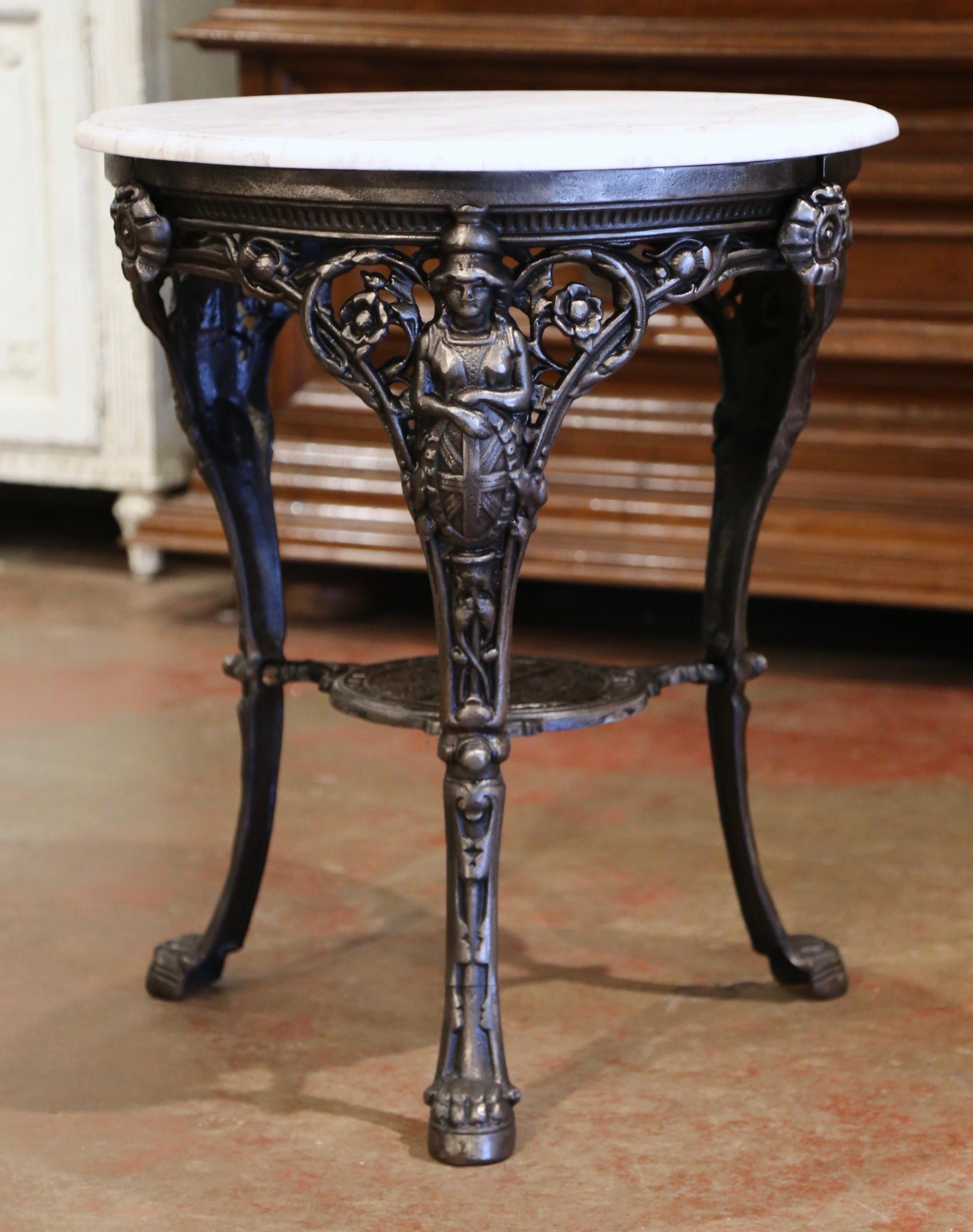 Decorate a patio or sun room with this elegant antique three-leg gueridon. Crafted in England circa 1880, the pub table stands on three cabriole legs with female figures at the shoulder and ending with paw feet; the legs are joined together with a