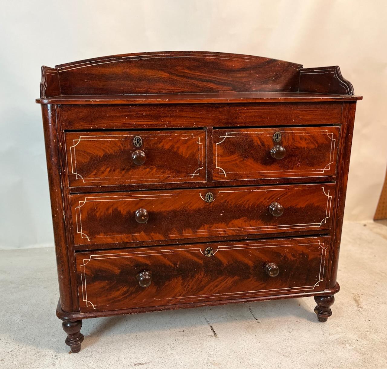 19th century English painted dresser.  Two over two drawers with a gallery that has been faux painted with great fun detail.   Good patina and great size.
