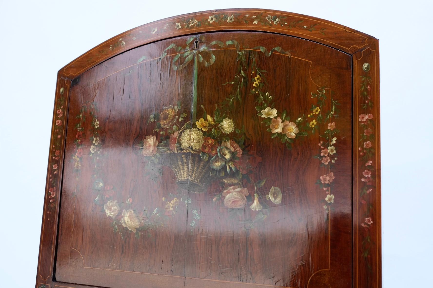 Very finely hand painted. 19th Century. English. Satinwood. On original casters. Letter cubbies and drawers. Purchased in London in 1990 for 18,000 British Pounds. Legs spread (bow) to 18.5