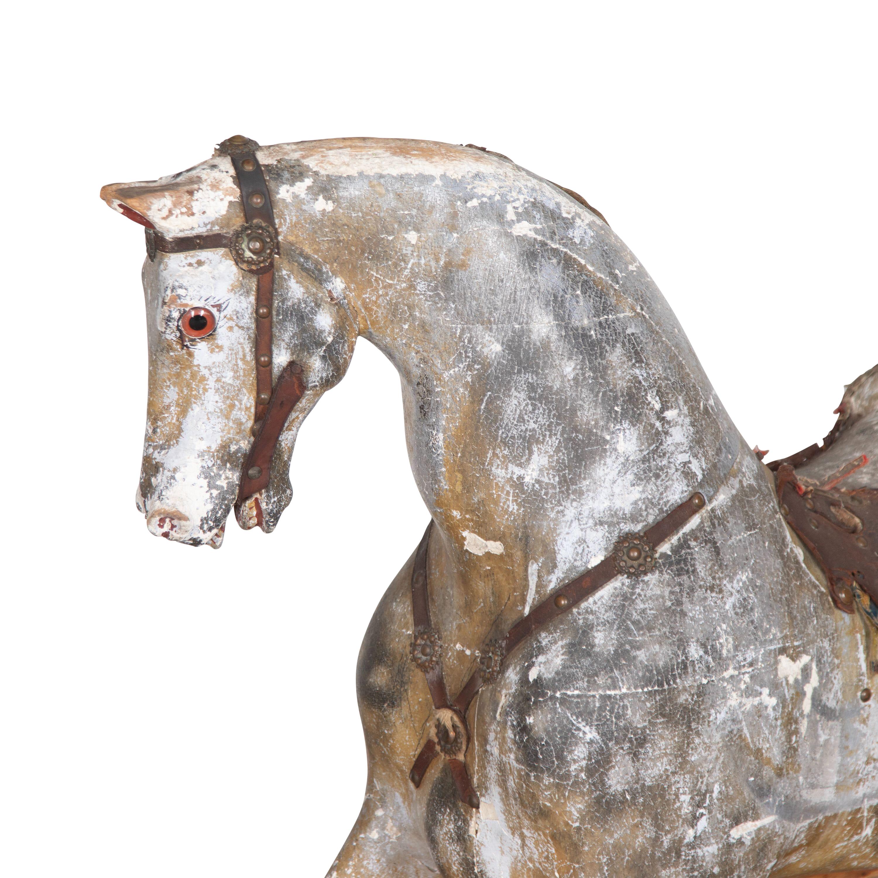 Rare 19th Century nursery rocking horse by Paul Leach.
With a dished head and flared nostrils.
Original dappled paint with wear commensurate with age.