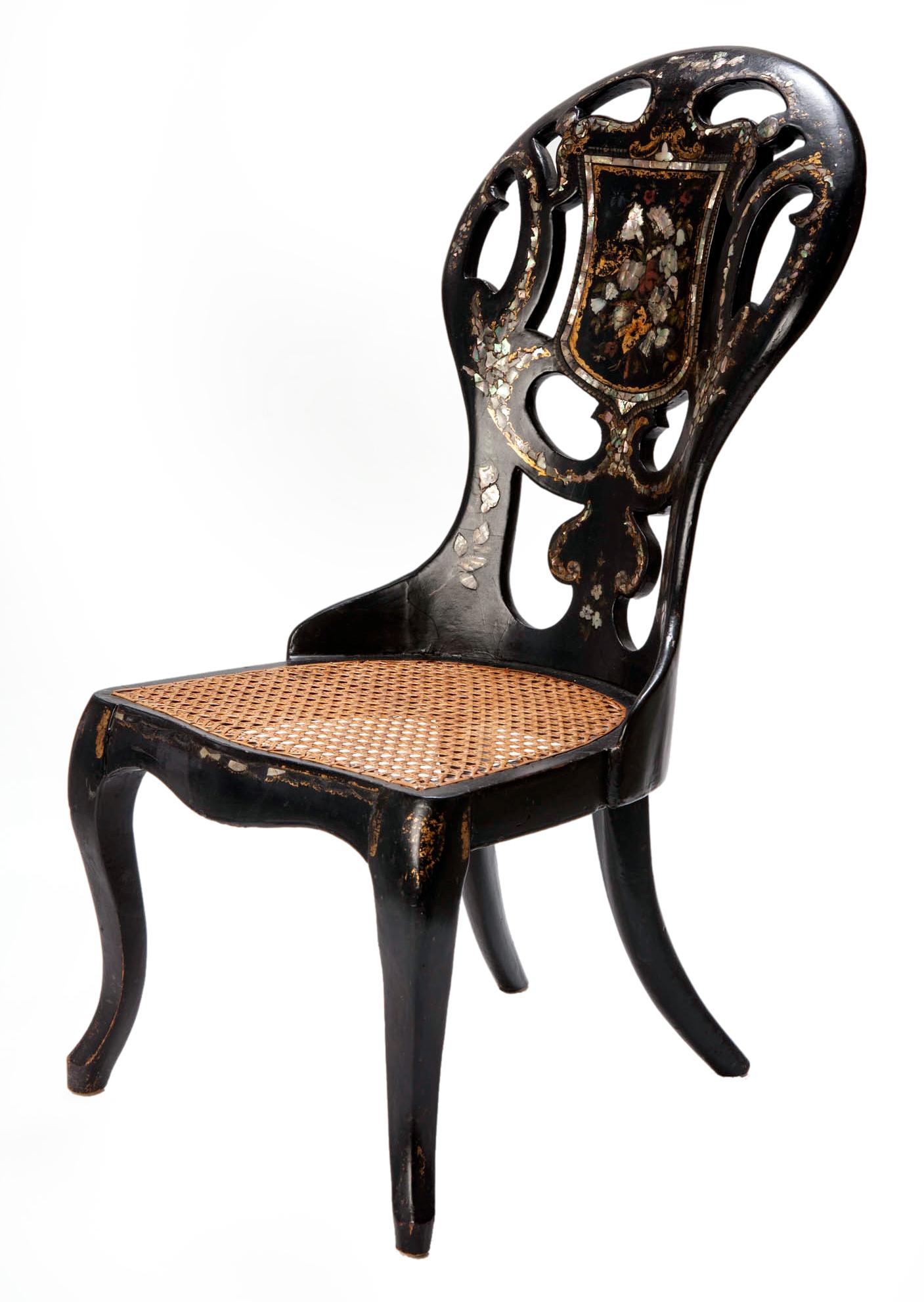 A very fine wood and papier mâché English chair with inlaid & hand painted back & legs. Gilt accents with mother of pearl inlay, buffed to a warm polish.
The back depicts an abstract floral design. 
The original hand caned seat is in excellent