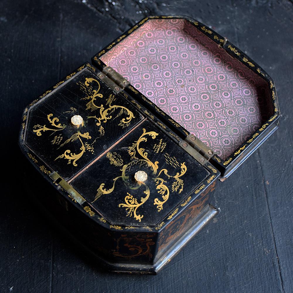 19th Century English Papier Mache tea caddy

We are proud to offer a decorator's joy, this outstanding early English Victorian Papier Mache tea caddy with its shaped body is smothered in the most wonderful black paint detail and a plethora of