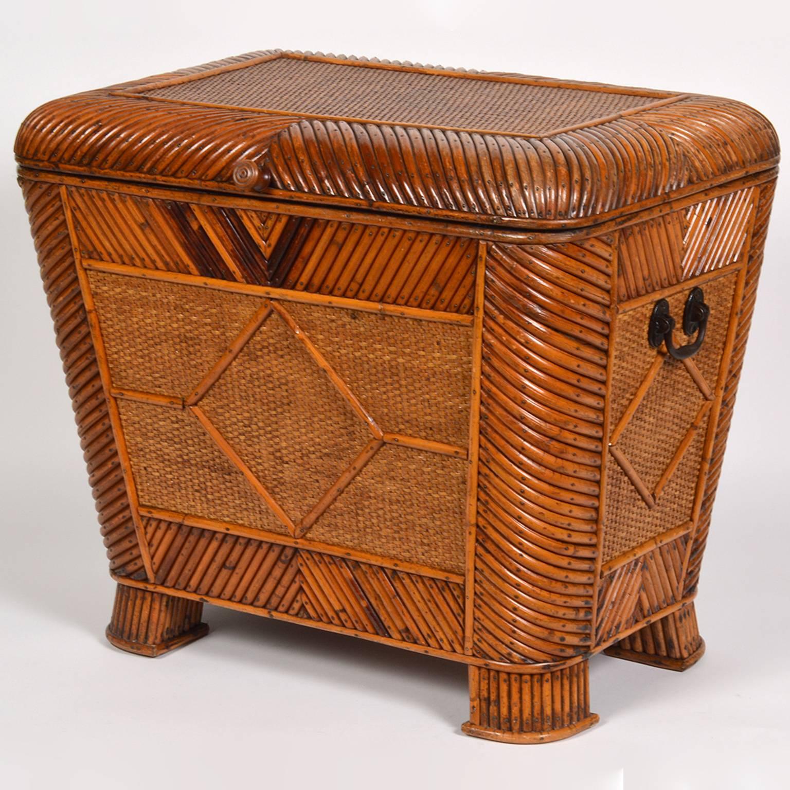 Standing 19 inches tall this charming and delicately detailed box can also serve as an exotic side table. The bamboo is applied to a wooden frame in changing diagonal patterns framing panels of raffia weave. The box is finished on all four sides and