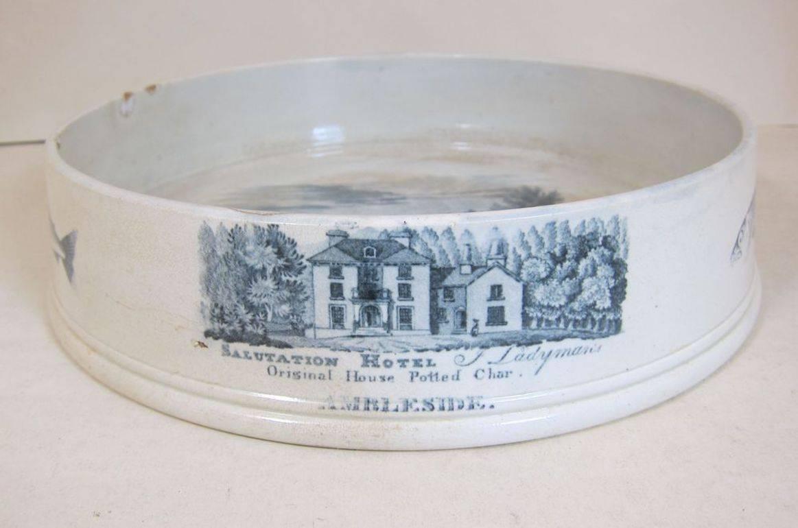 A Rare English pearlware large Char Pate Dish with a print of the Salutation Hotel, Ambleside and the Char pate makers name of JL Ladyman. There also four fish prints around the outside of the dish.
It is very unusual to have the makers name and the