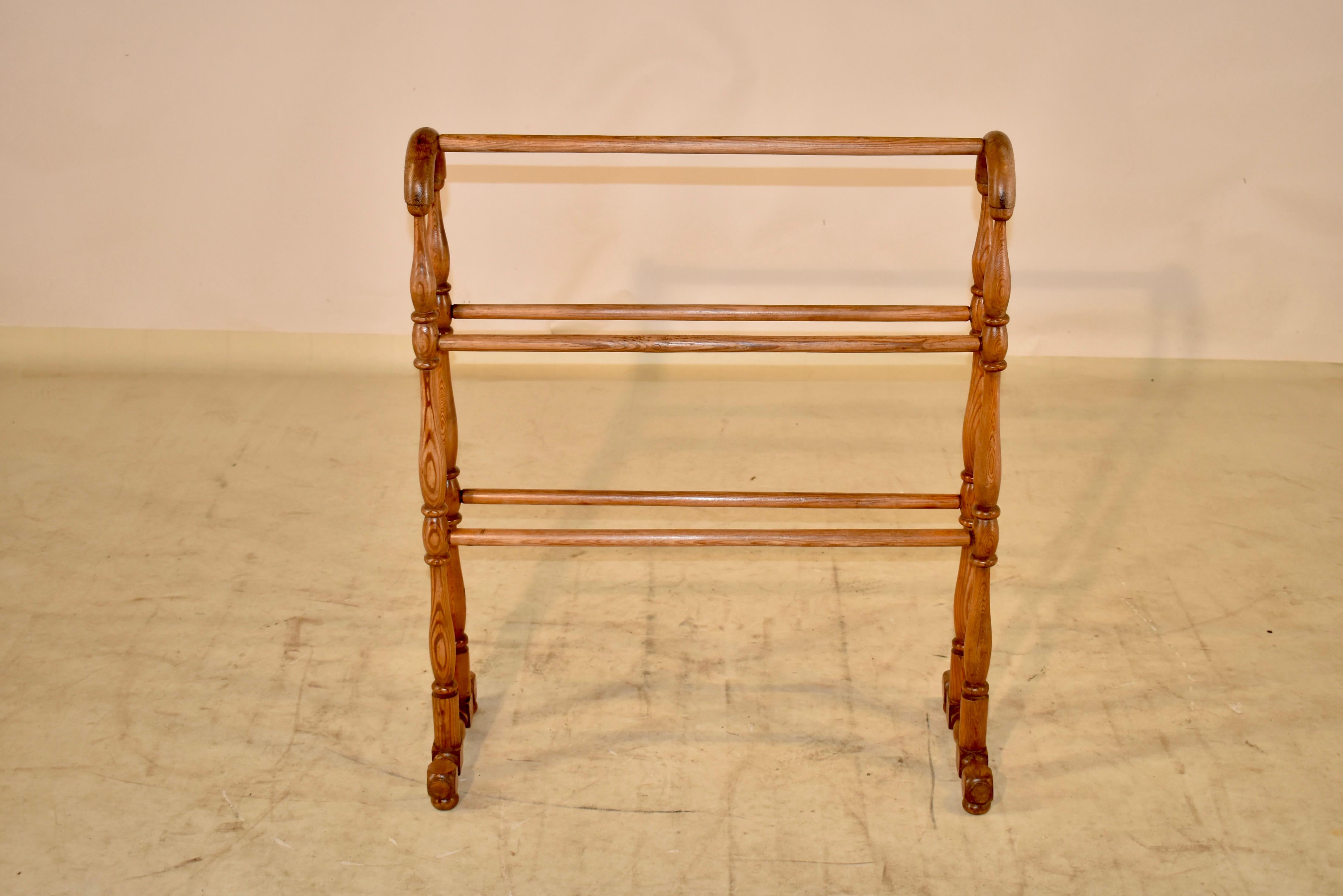 19th century pine blanket stand from England.  The piece has wonderful turnings that form the legs, joined by simple rails for displaying quilts, or for use in a room for additional blankets.  Lovely color and size.