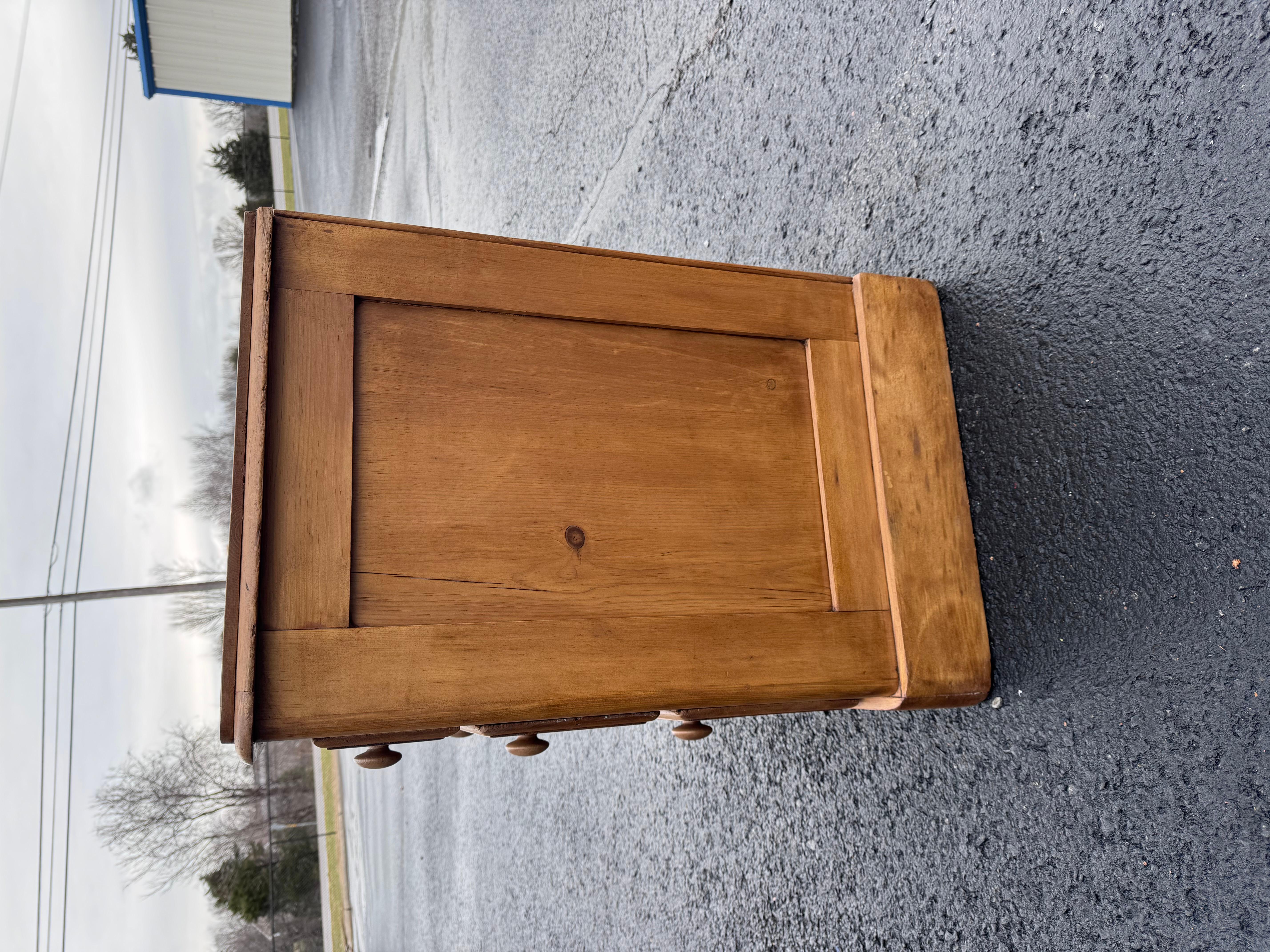 This is a lovely antique pine chest! This piece dates to the 19th century and has lovely patina. The wood has a warm glow, that is accented perfectly by the original knobs. Being a two over two design with a casual simple feel. This chest would make