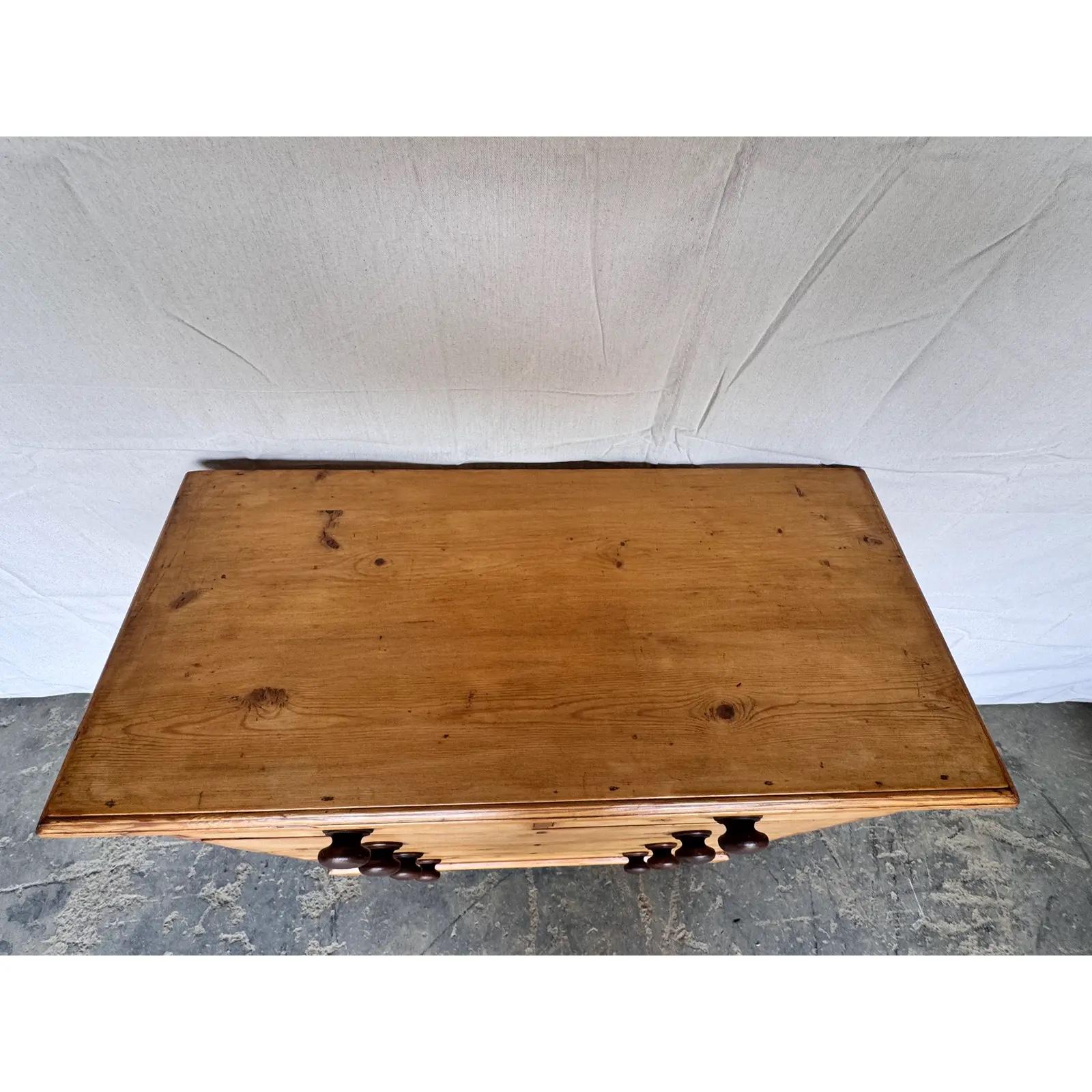 This is a lovely English 2 over 3 pine chest! This piece dates to the 19th century and has lovely patina. The wood has a warm glow, that is accented perfectly by the darker stained knobs. Being a two over three design with a casual simple feel. This