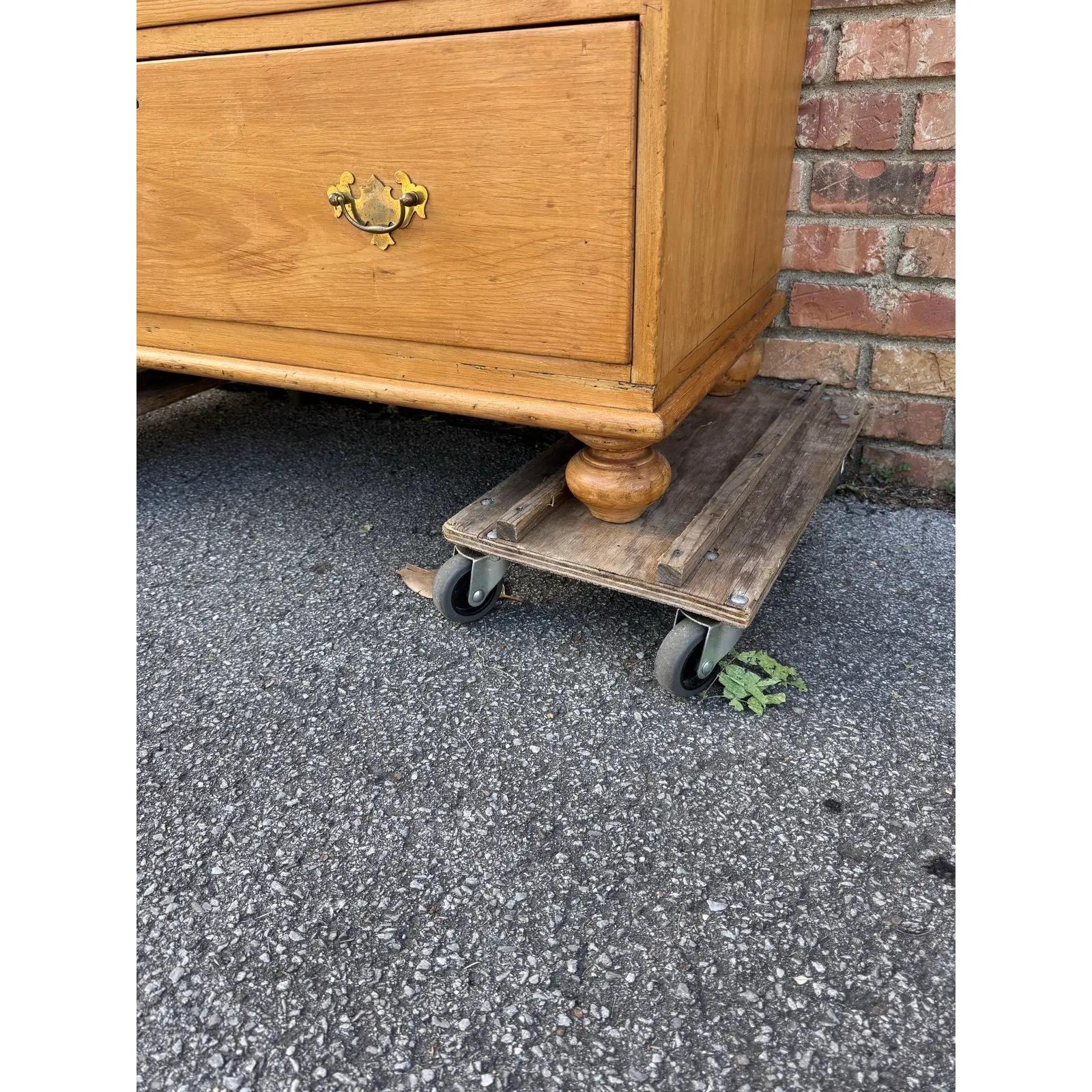This is a lovely antique pine chest! This piece dates to the 19th century and has lovely patina. The wood has a warm glow, that is accented perfectly by the brass pulls. Being a 4 drawer design with a casual simple feel. This chest would make an