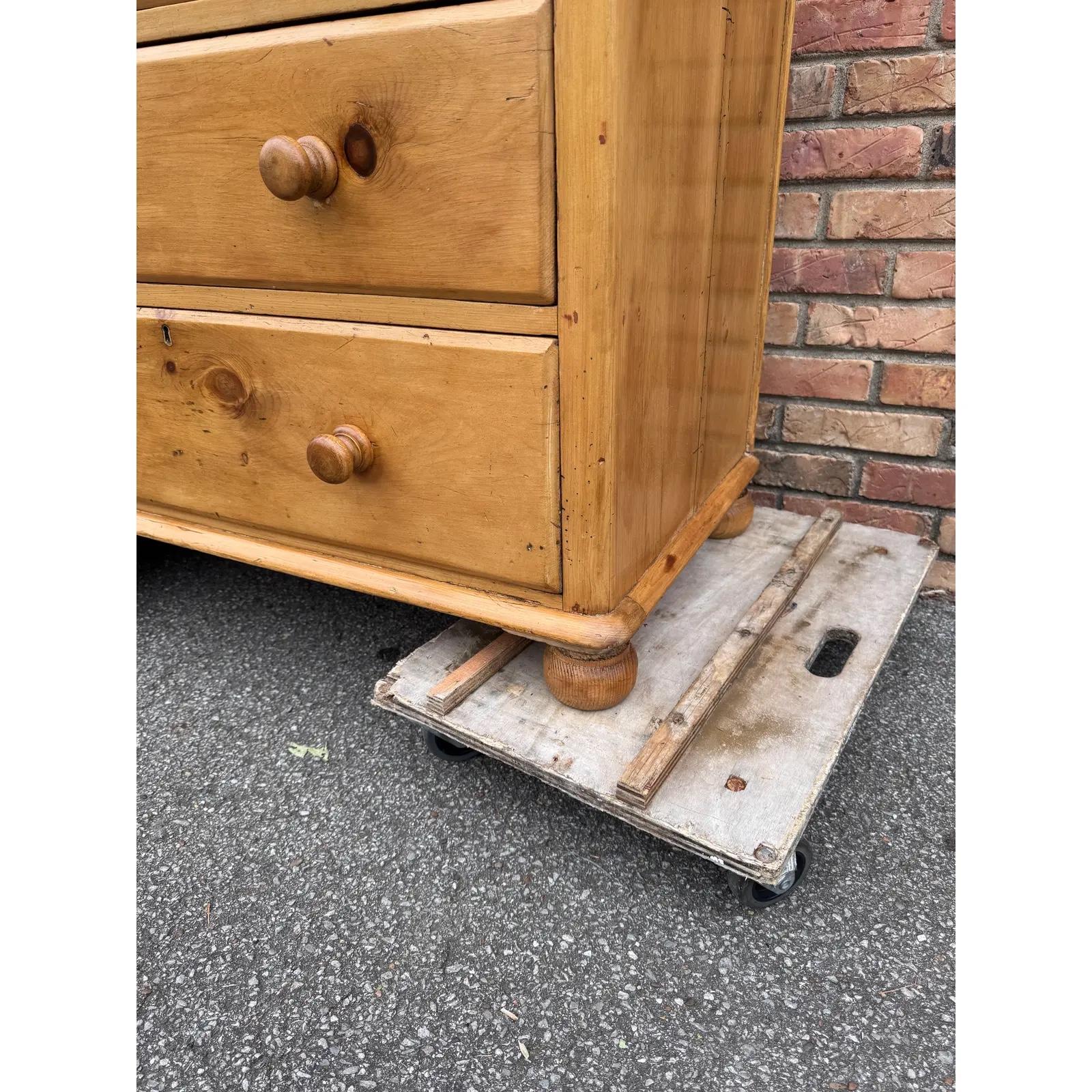 This piece dates to the 19th century and has lovely patina. The wood has a warm glow, that is accented perfectly by the darker stained knobs. Being a two over three design with a casual simple feel. This chest would make an excellent addition to a