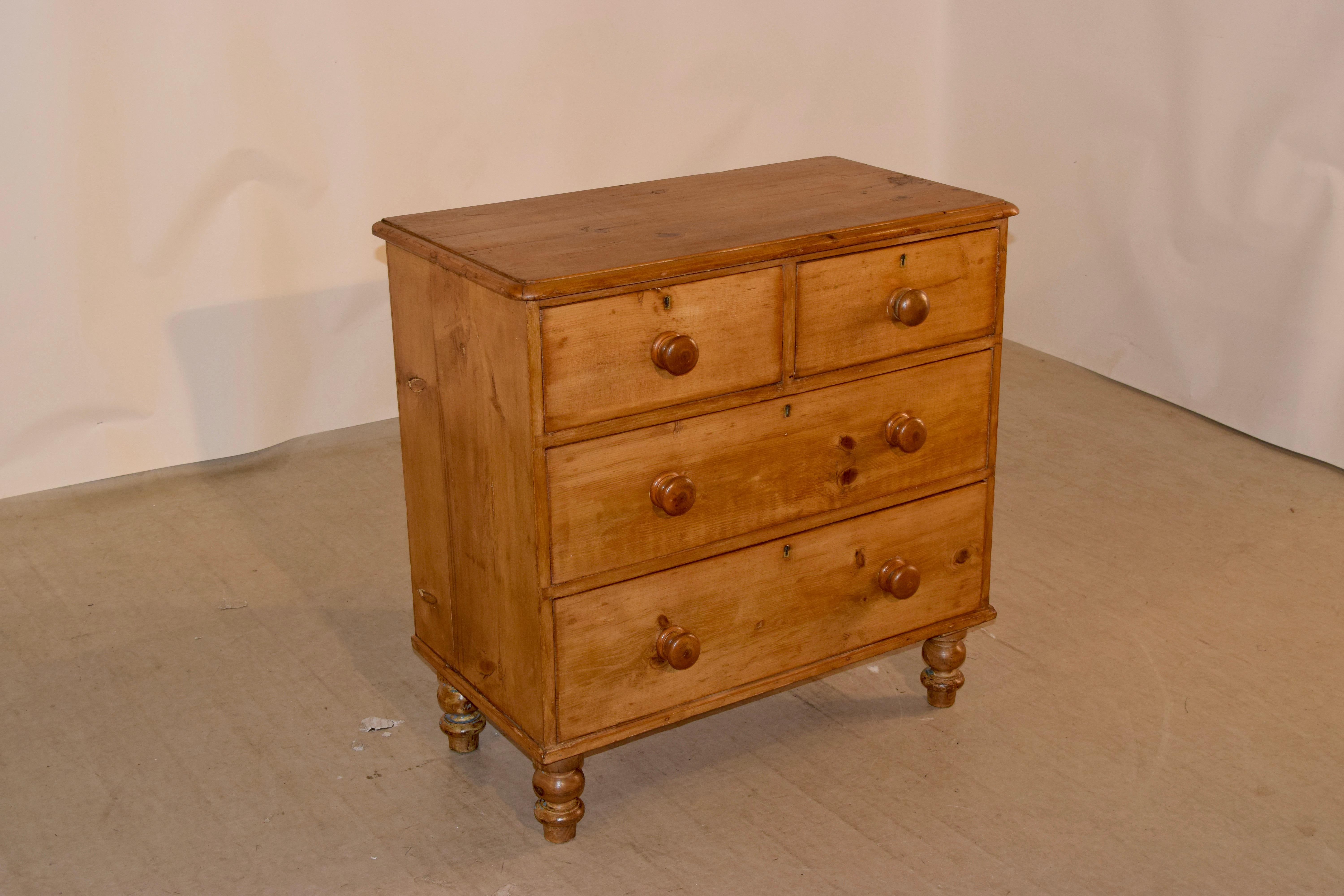 19th century pine chest of drawers from England with a beveled edge around the top, following down to two over two drawer configuration and simple sides. The case is supported on hand turned feet.