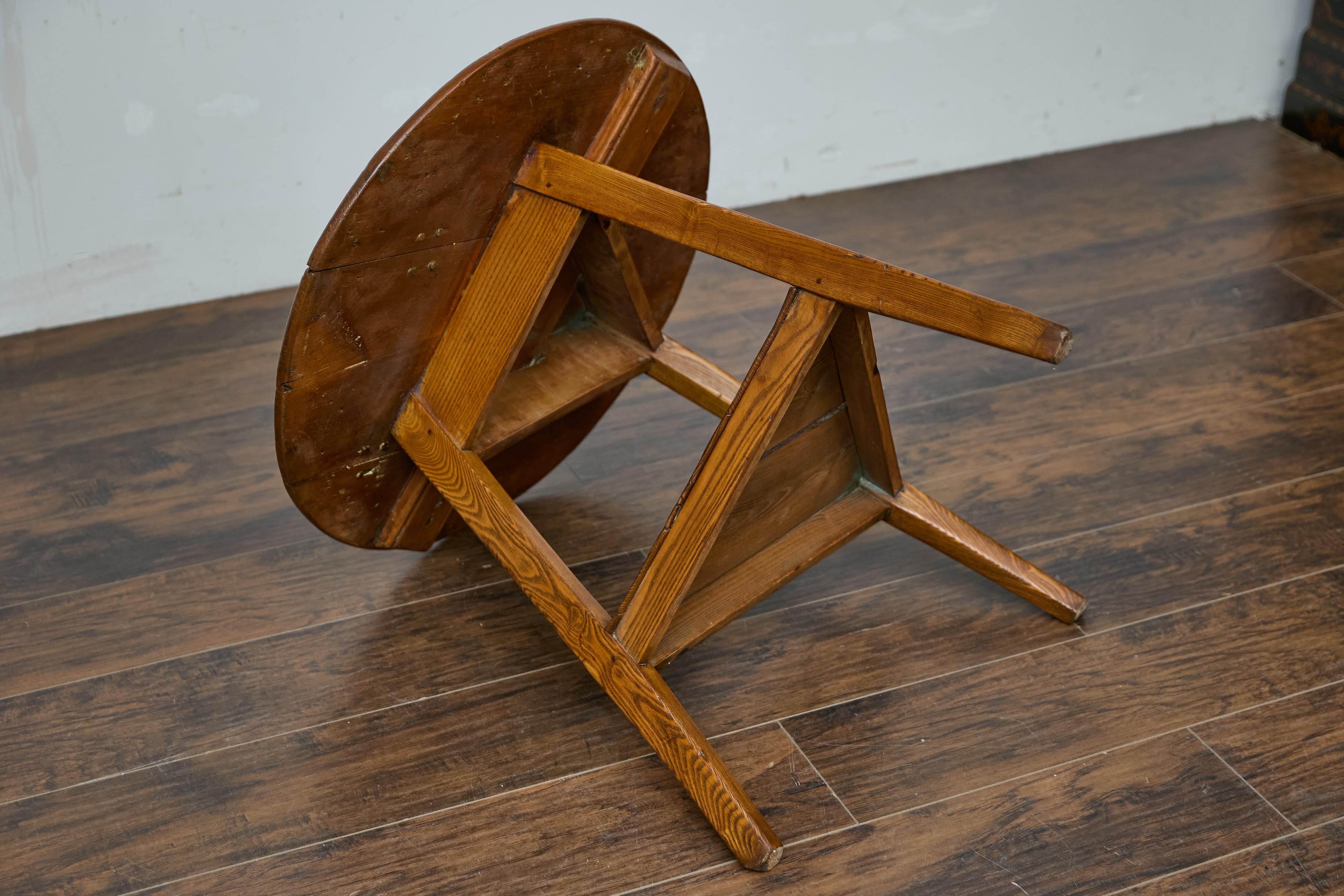 19th Century English Pine Cricket Table with Tripod Base, Round Top, and Shelf 11