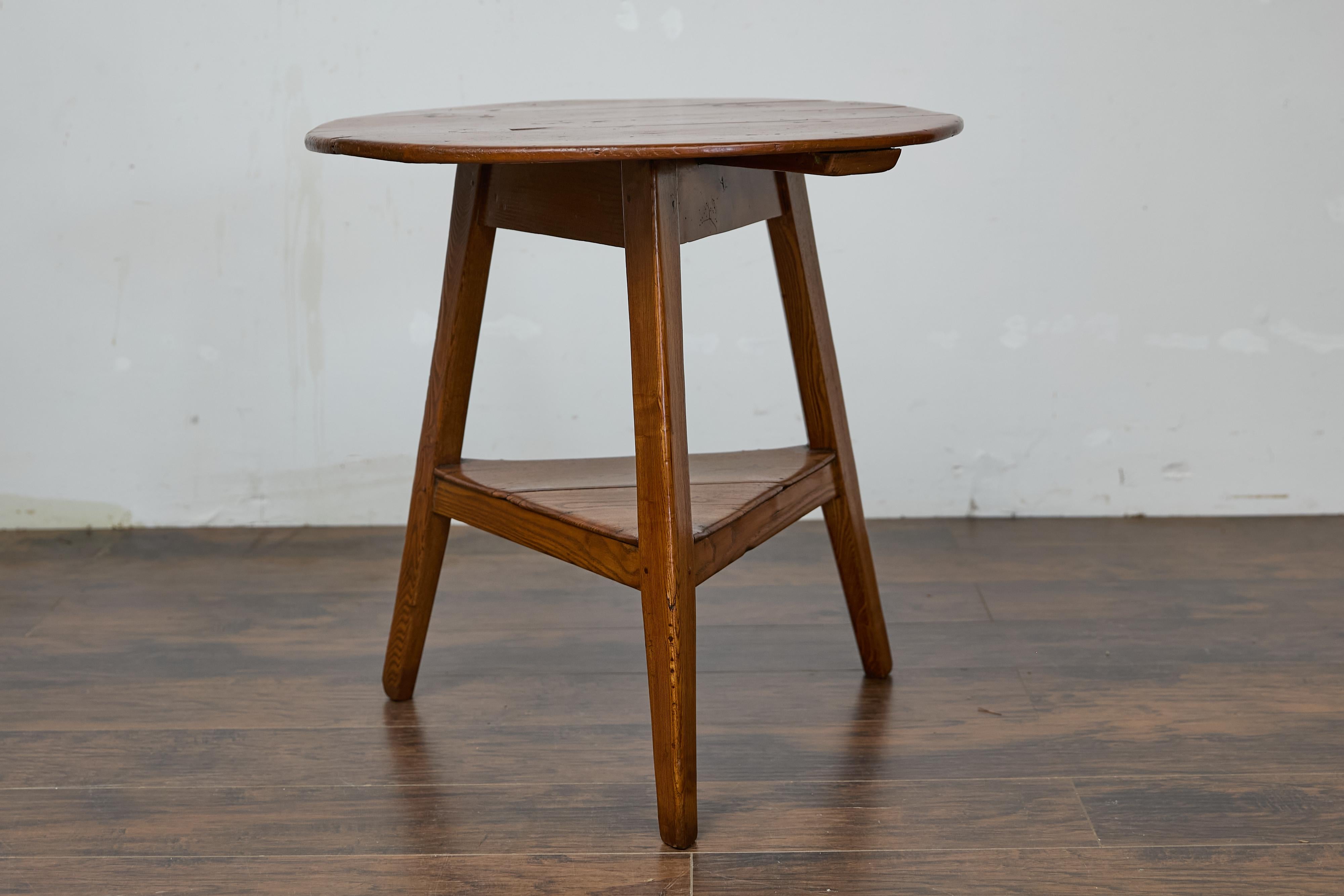 19th Century English Pine Cricket Table with Tripod Base, Round Top, and Shelf 1