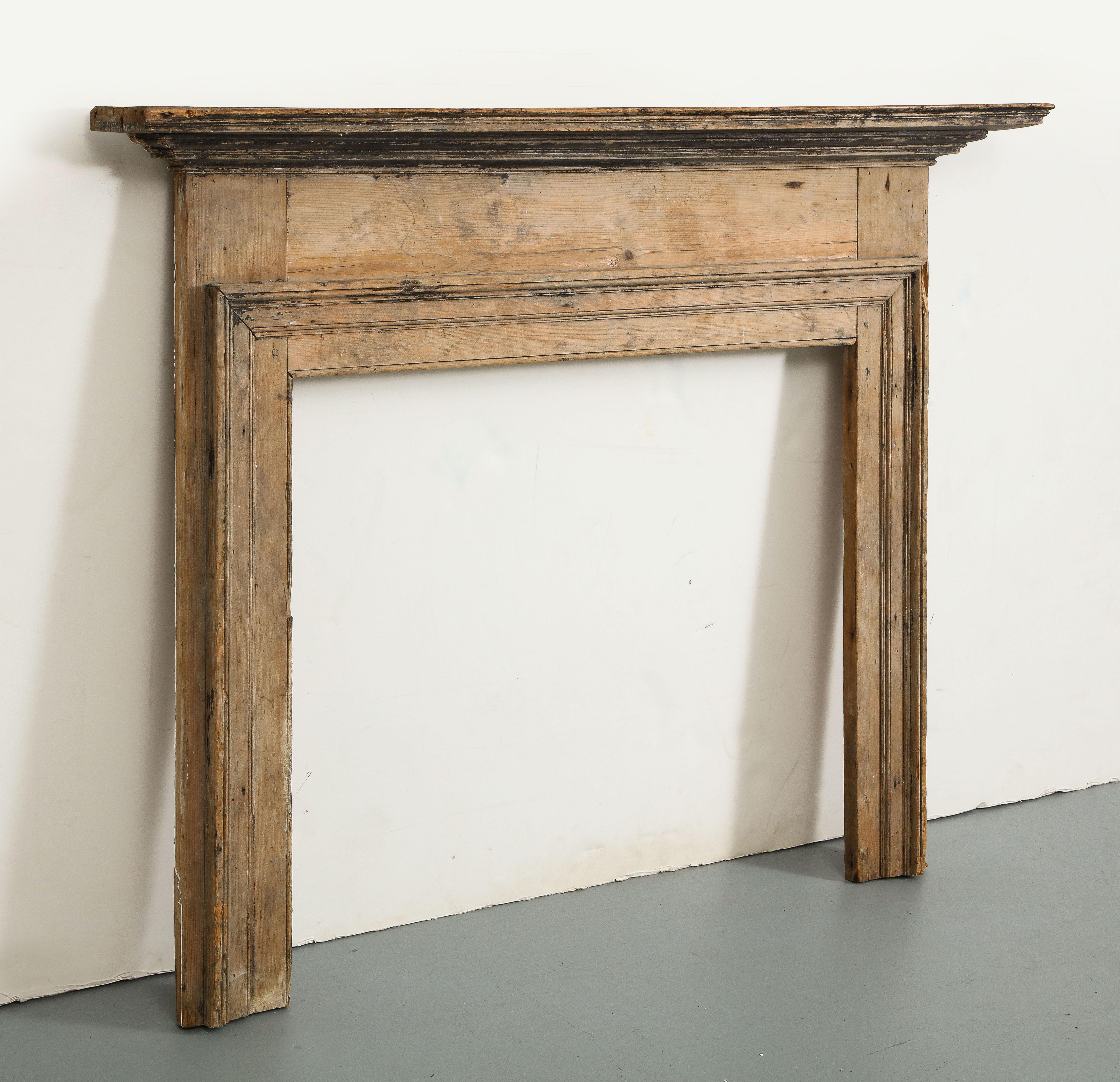 Rustic farmhouse style 19th century English pine fireplace mantel. Moulding details around firebox.

Opening is 37.5