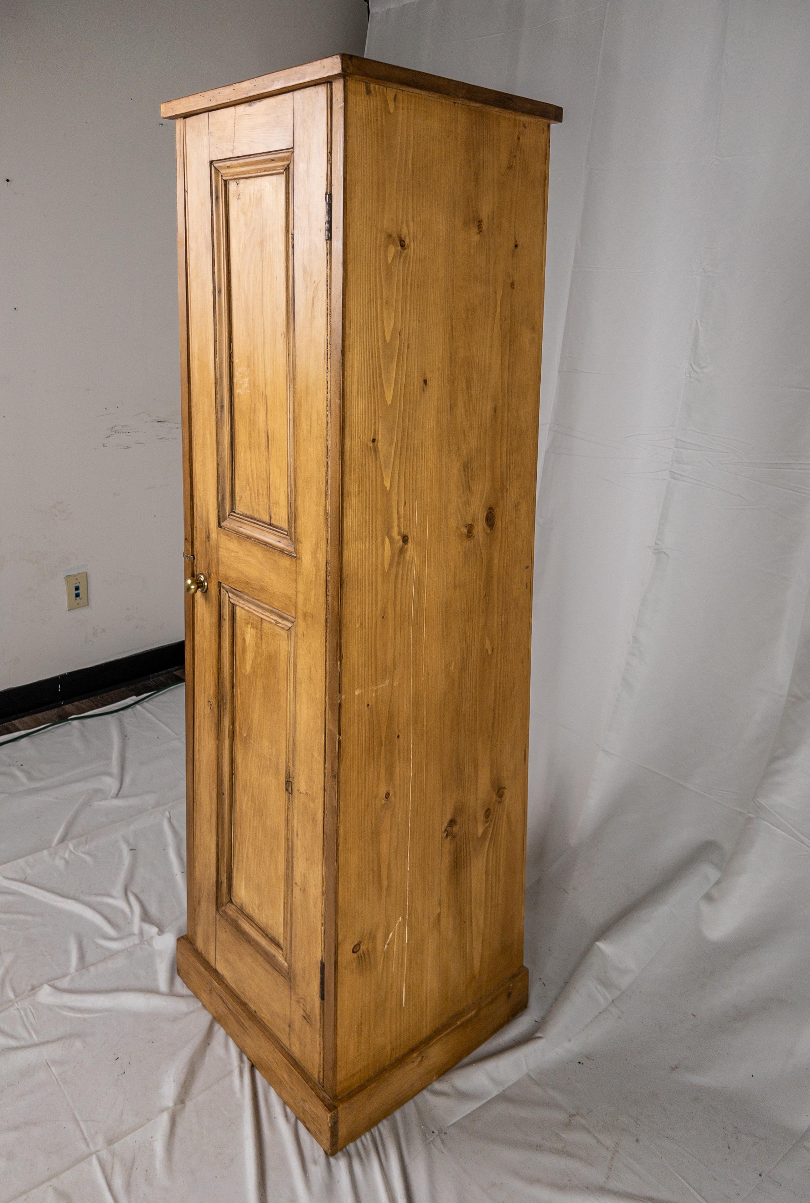 19th century English pine tall cabinet with 3 shelves inside.