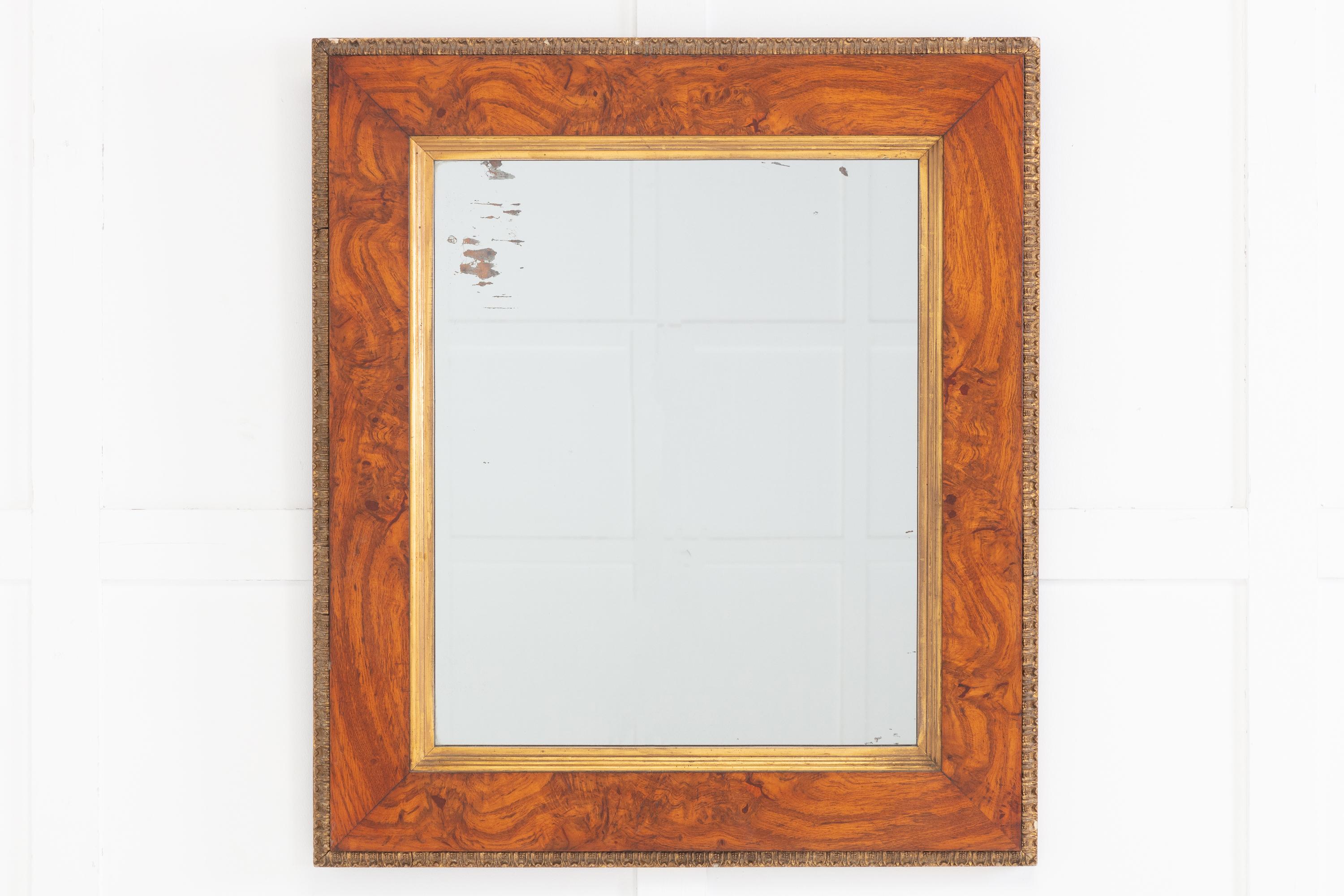 19th Century English pollard oak wall mirror of simple and elegant design, in a moulded frame with inner gilt slip and carved and gilded outer border.

Pollard oak is the wood derived from oak trees that have been ‘pollarded’. Pollarding is a