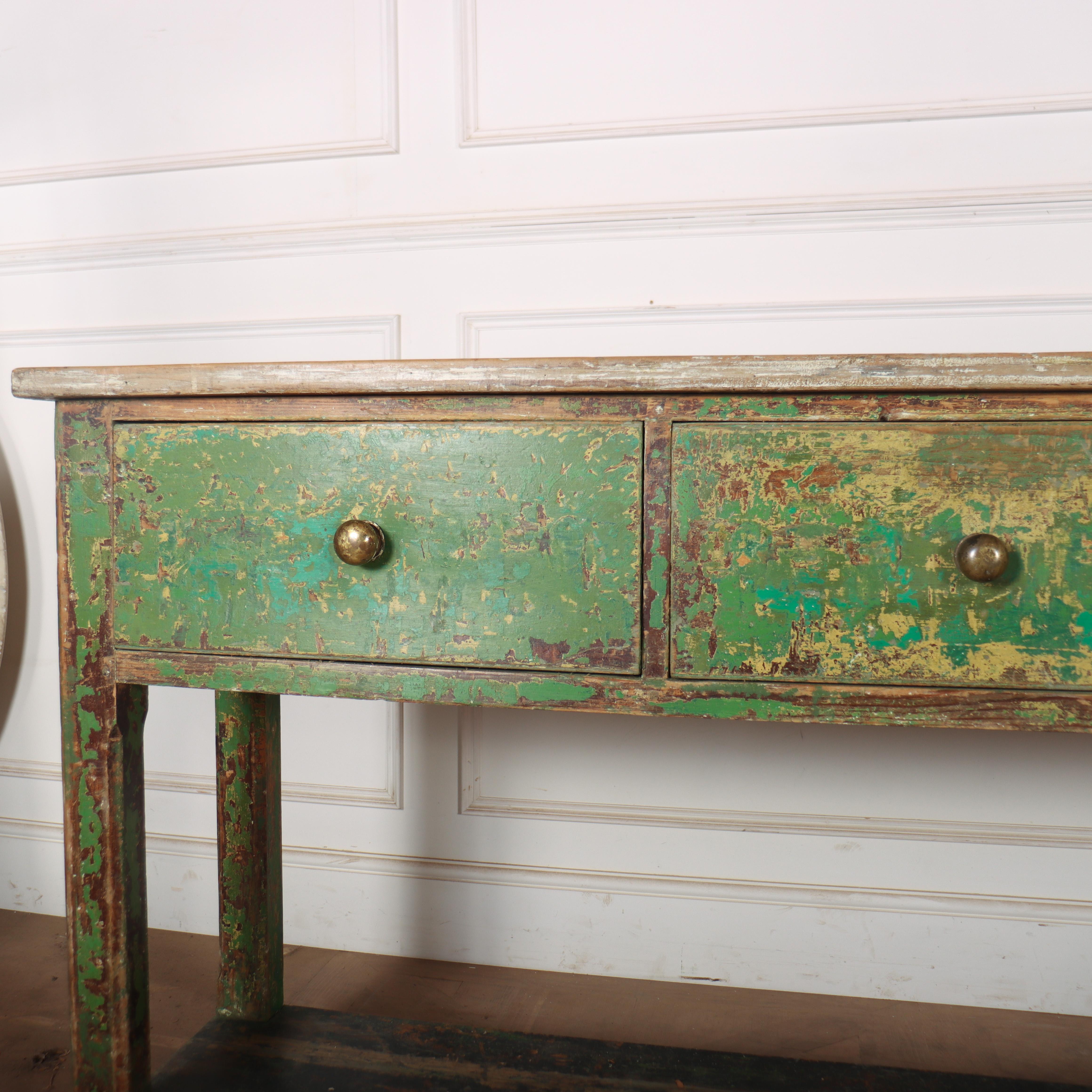 Early 19th century English potboard dresser base with original paint finish and good worn pine top. 1820. 

Code: 8742

Dimensions:
W: 86