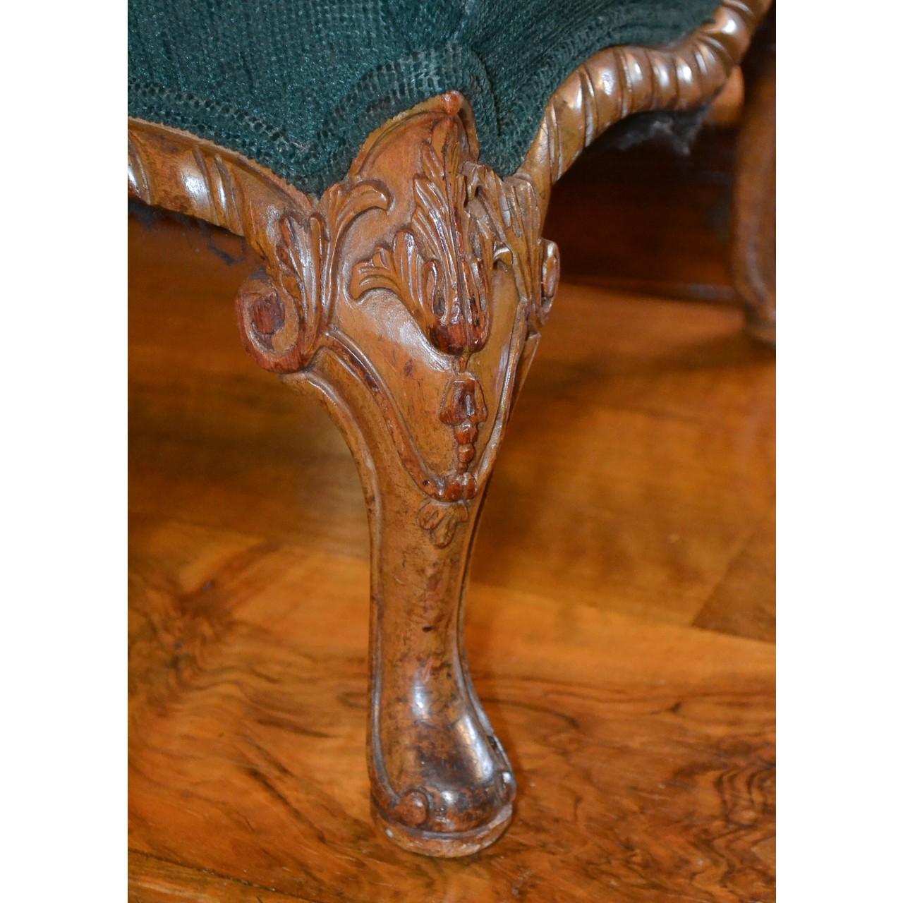 Fine quality 19th century English Queen Anne style walnut ottoman or stool with upholstered top. Superbly carved serpentine-shaped trim and carved knees ending in a pad foot. Beautifully aged patina,

circa 1890.