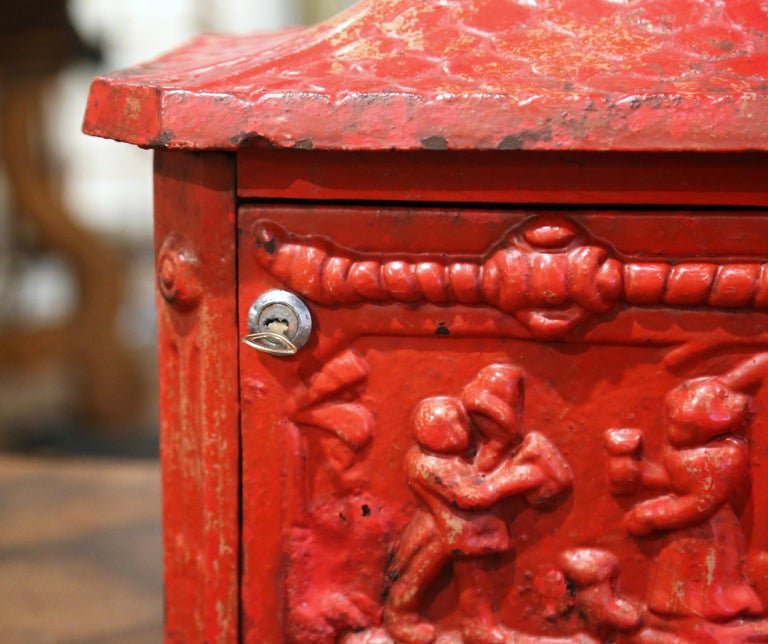 19th Century English Red Painted Cast Iron Mailbox with Relief Decor at