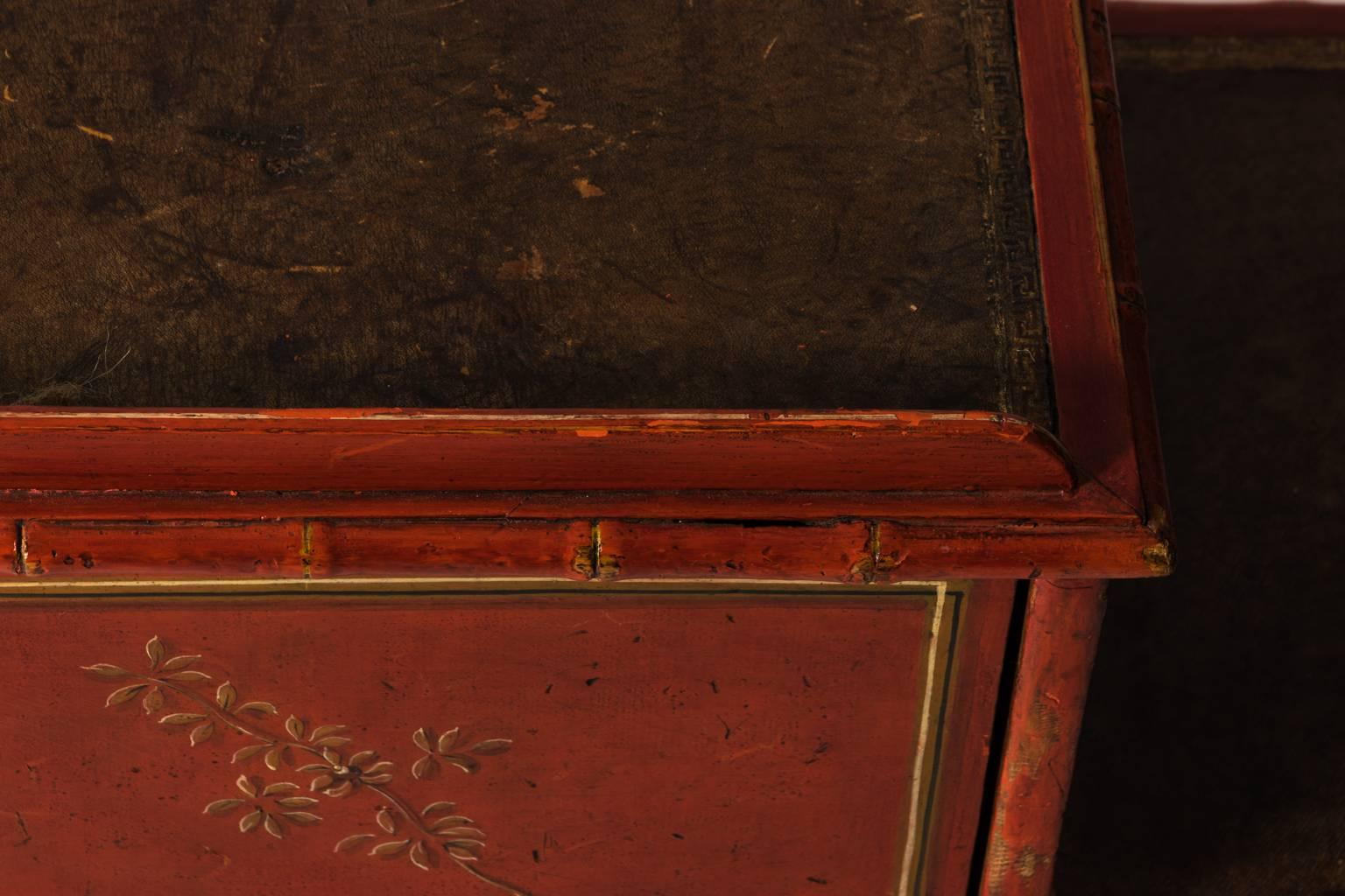 Red painted English bedroom steps with faux bamboo trim and painted floral details, circa 19th century. Please note that this piece has a crack in the wood on the back.
 