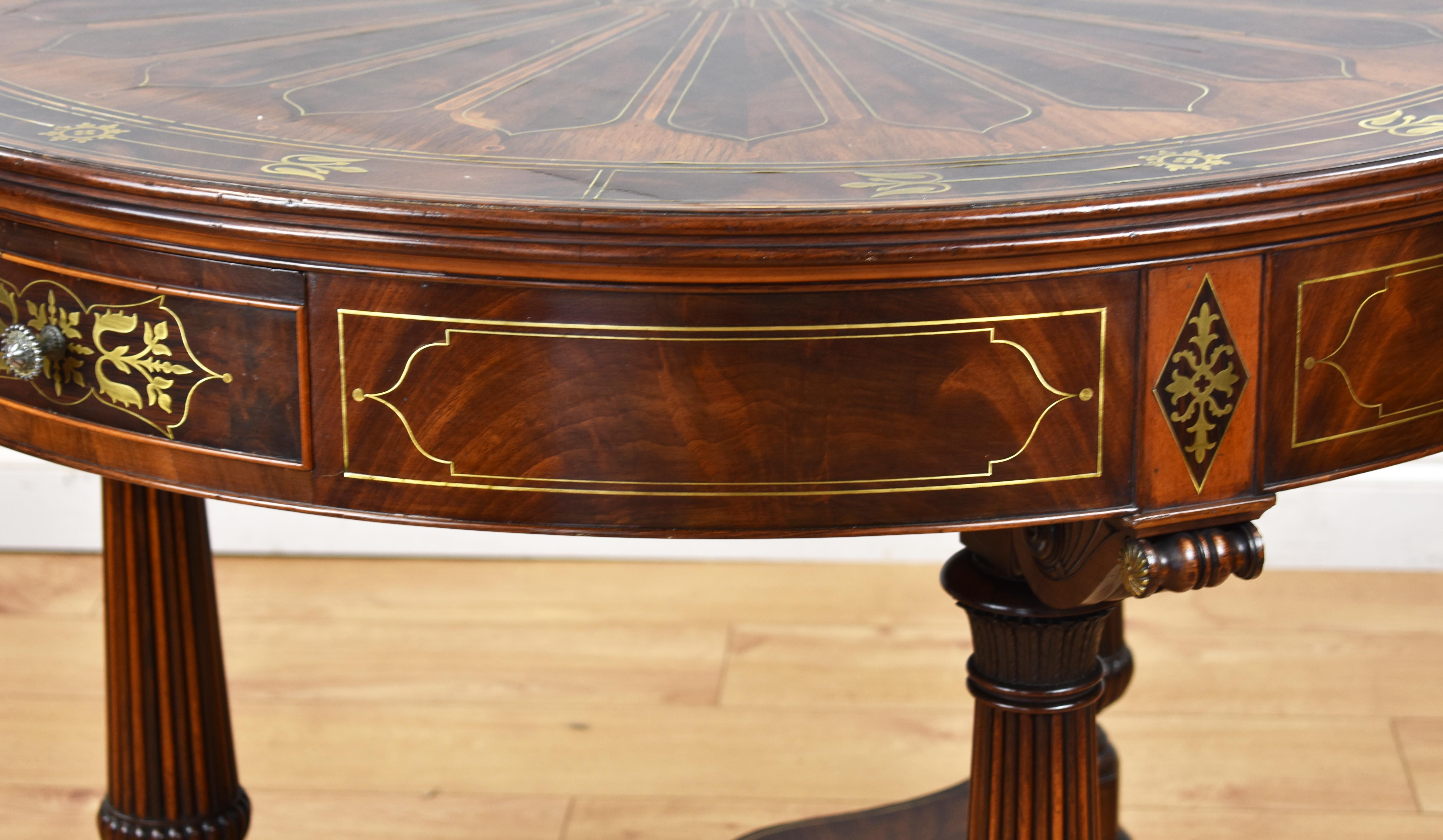 20th Century 19th Century English Regency Flame Mahogany Brass Inlaid Drum Table For Sale