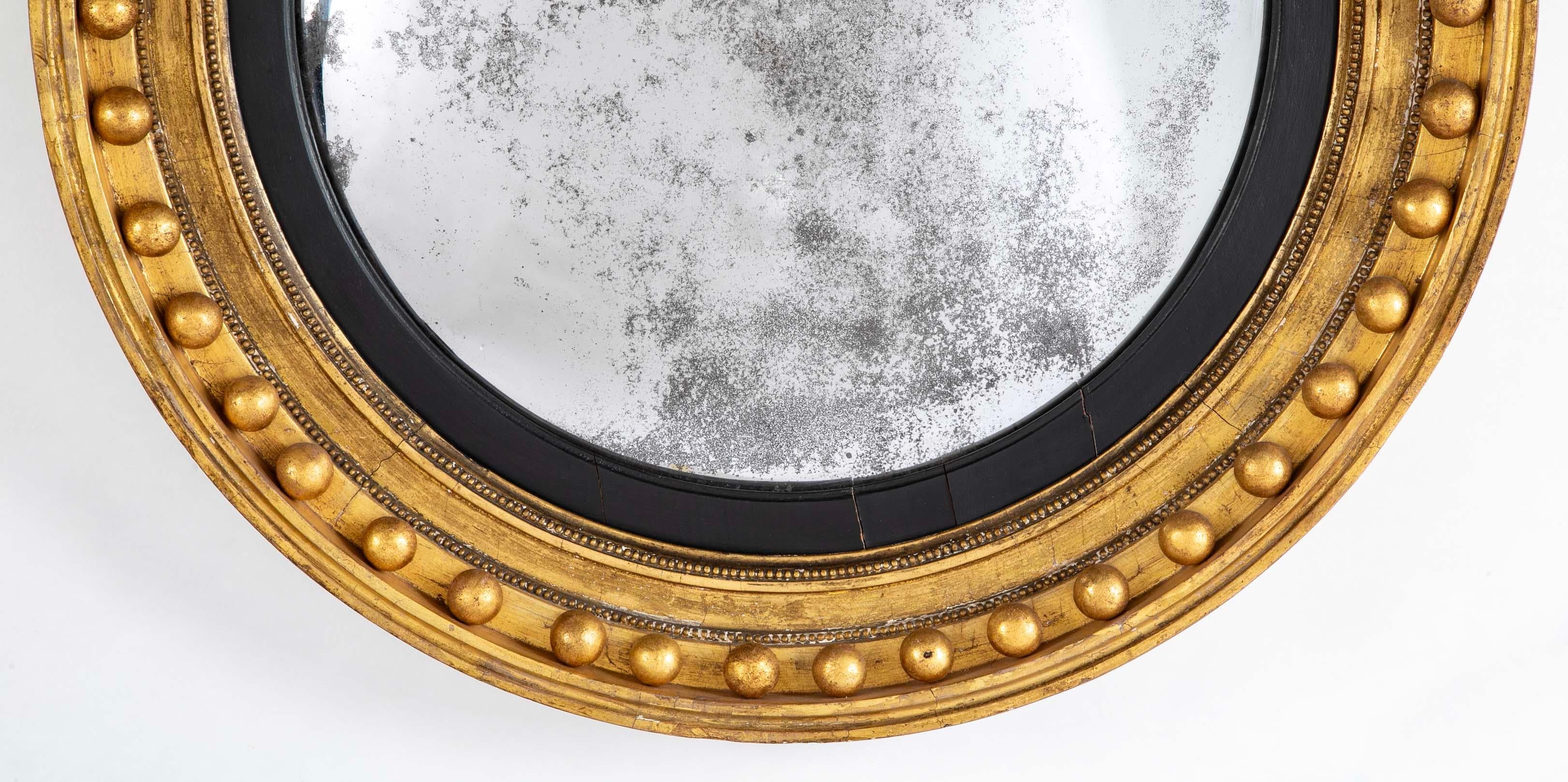 Hand-Carved 19th Century English Regency Gilt Wood Convex Mirror with Carved Eagle For Sale
