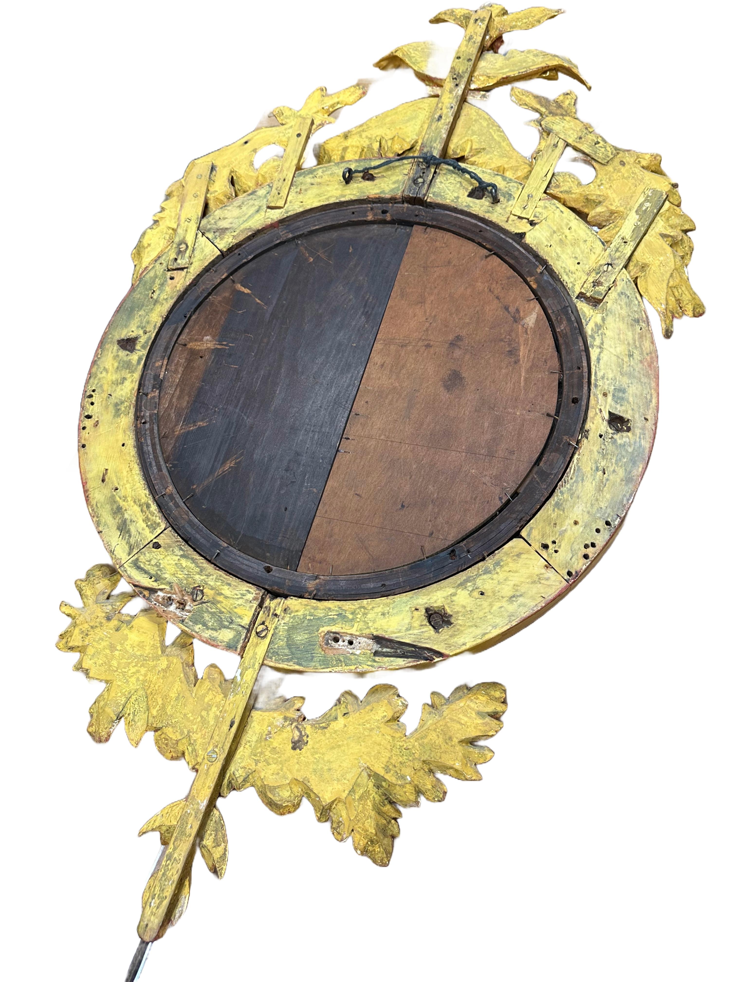 An elegant 19th century English Regency convex mirror. Giltwood frame with ornately carved acanthus leaf pattern crest. Made with convex mercury glass. 

No obvious markings on the mirror available.

In good condition. Some gentle wear consistent